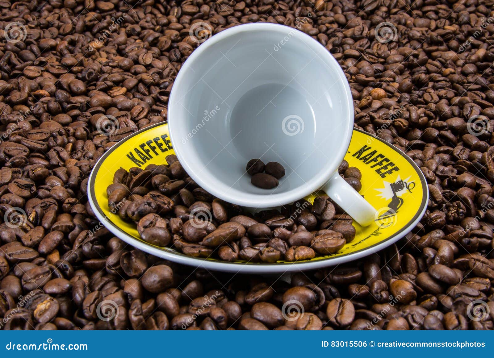 White Ceramic Cup On Yellow Plate With Coffee Beans Picture Image 83015506