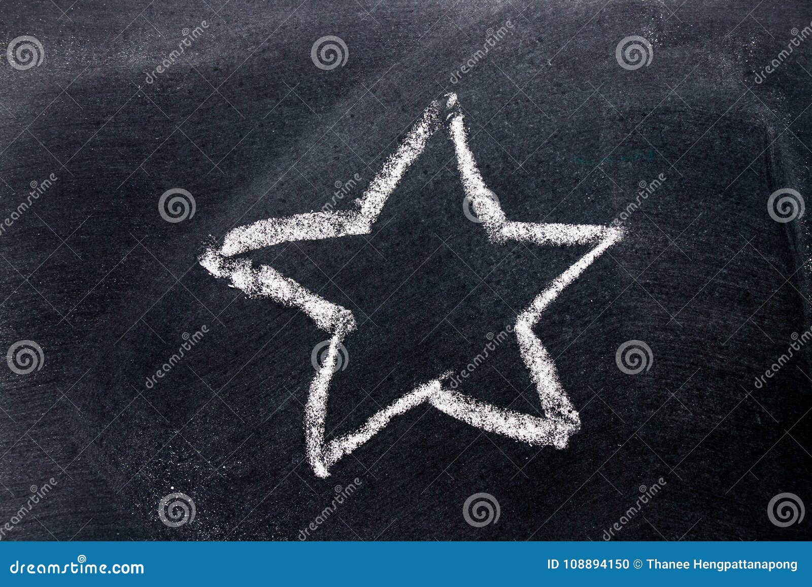 White Chalk Hand Drawing As Star Shape on Black Board Stock Photo