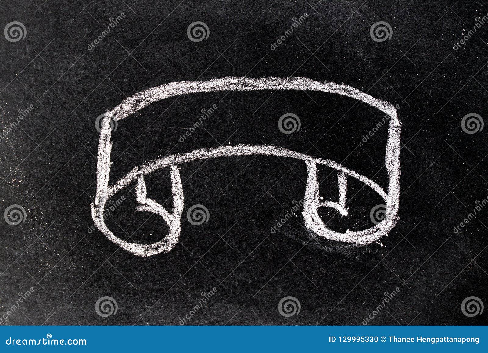 White Chalk Hand Drawing in Blank Scroll Banner Shape on Blackboard