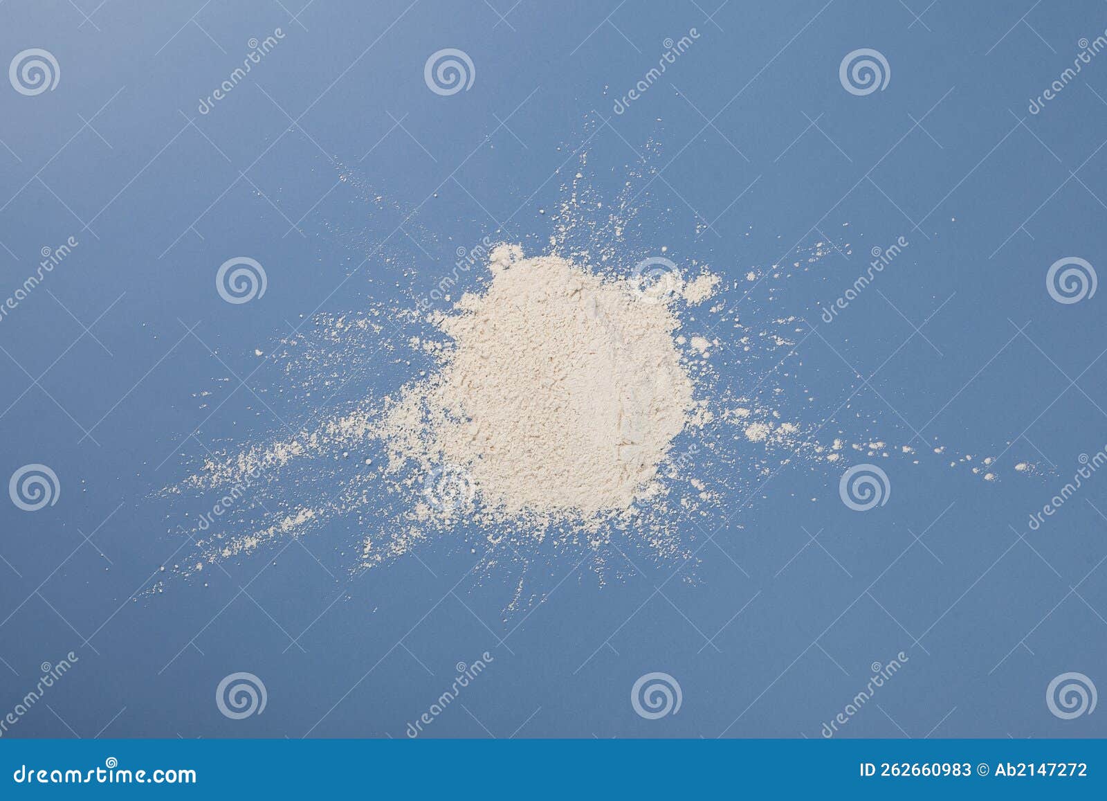 White Chemical Powder Scattered on Blue Surface. Pile of Titanium