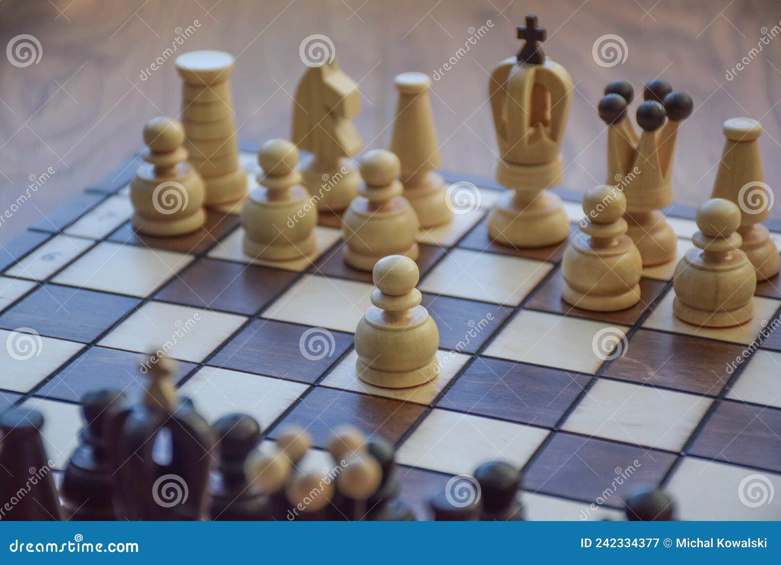The white pawn chess piece is starting the game on chessboard Stock Photo -  Alamy