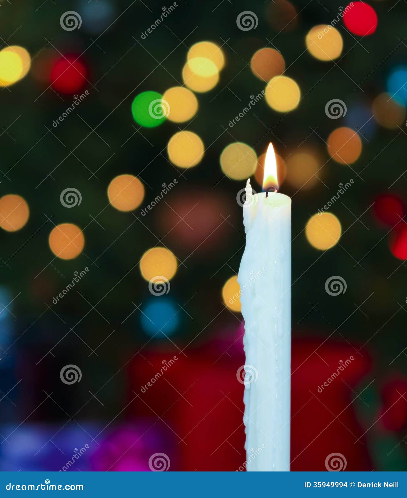 A White Christmas Candle with Blurred Lights Stock Photo Image of