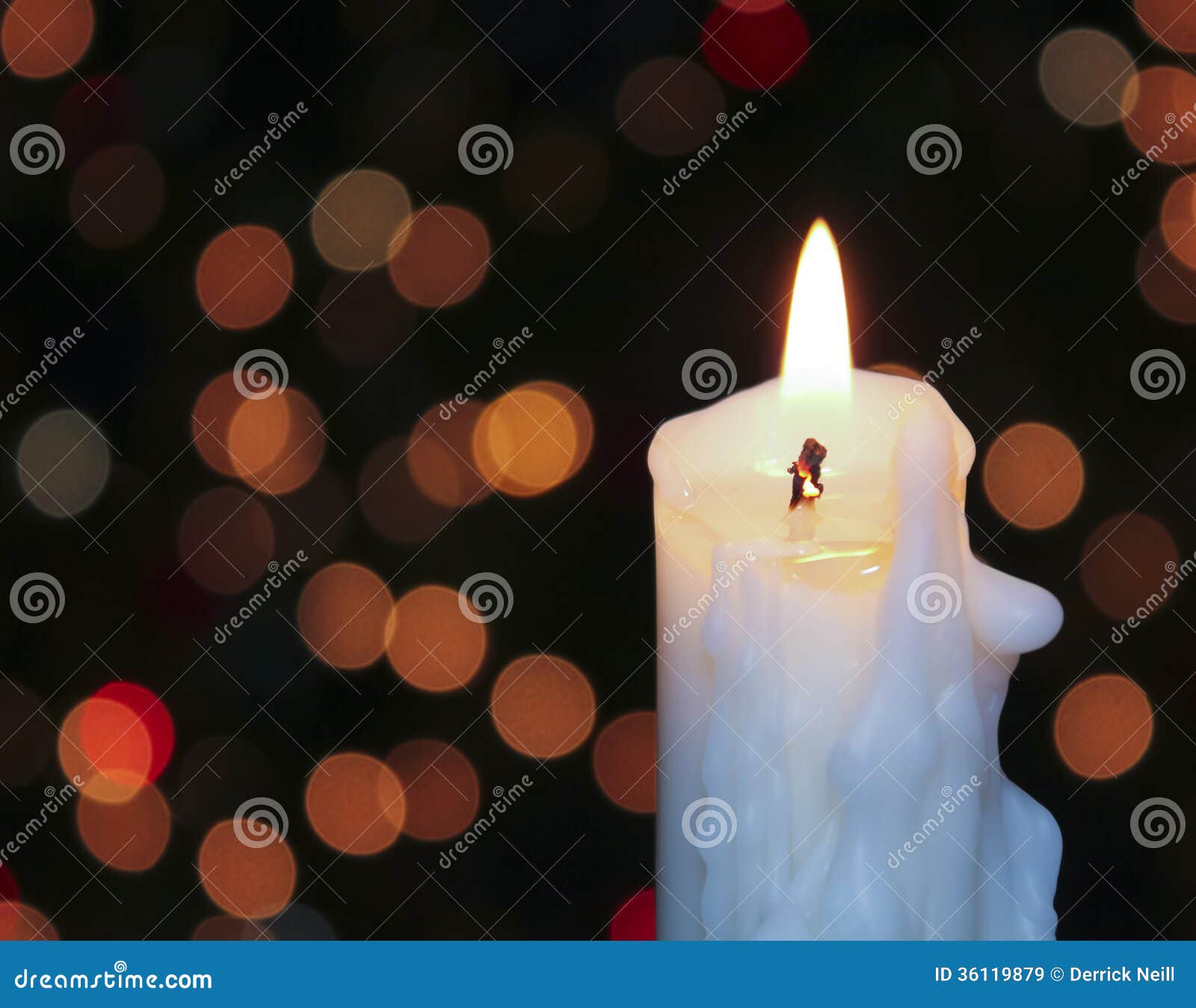 A White Christmas Candle with Blurred Lights Stock Image Image of