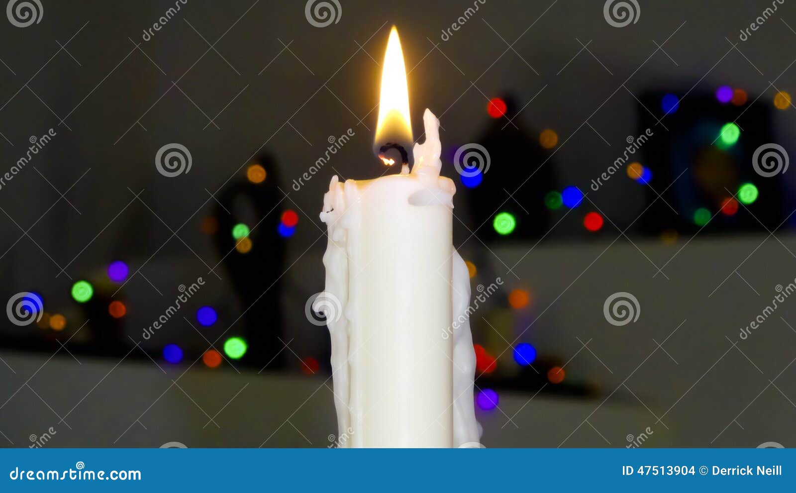 A White Christmas Candle with Blurred Lights Stock Photo Image of