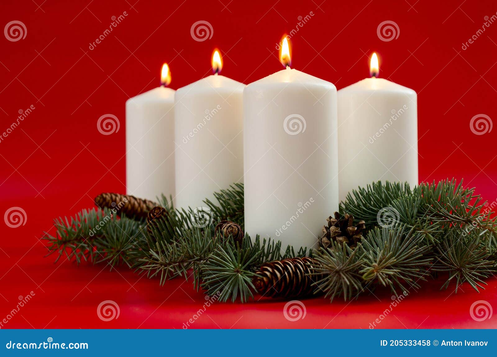 White Christmas Candles on Red Background, Advent. 4 Burning Candles