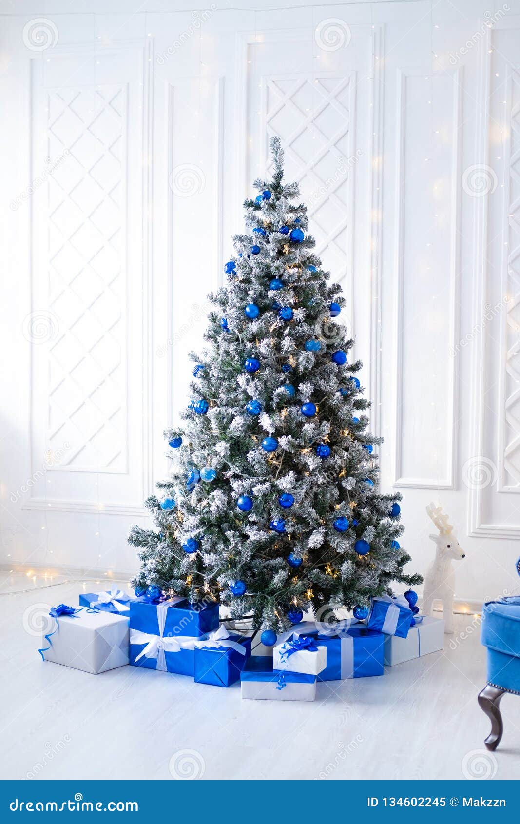 White Christmas Tree on White, Decorated with Blue Ornaments and ...