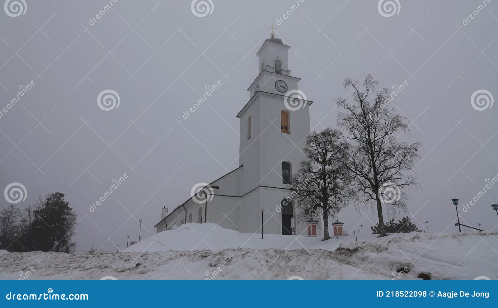 boda church in winter mist in dalarna, sweden