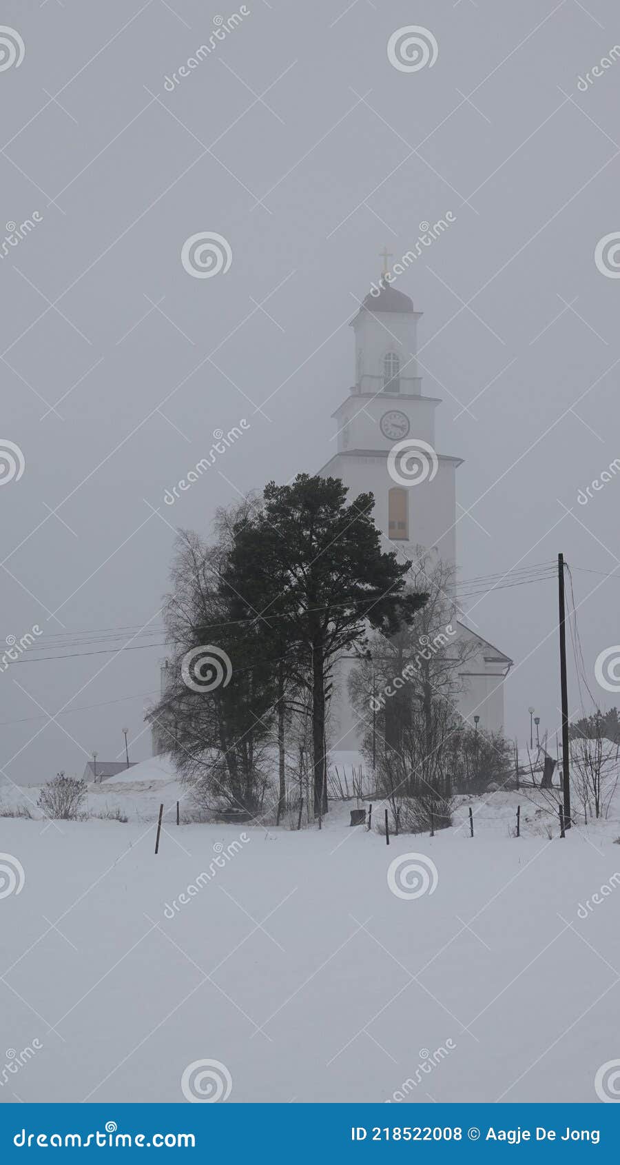 boda church in winter mist in dalarna, sweden