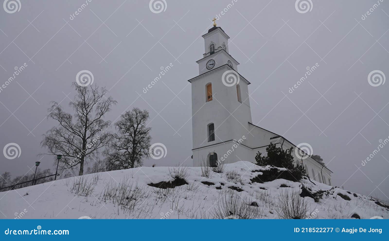 boda church in winter mist in dalarna, sweden