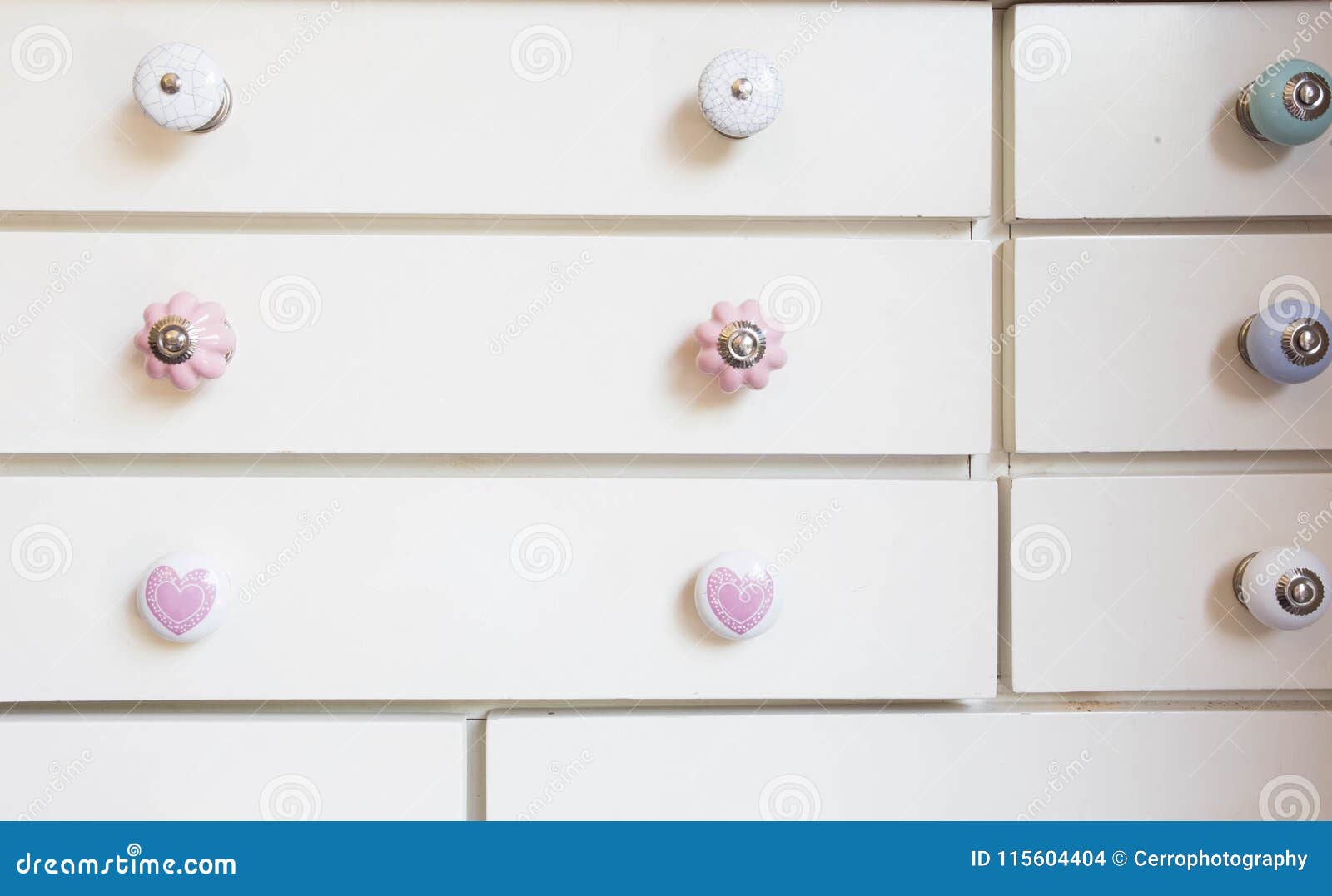 White Closet Doors With Colorful Knobs Stock Photo Image Of