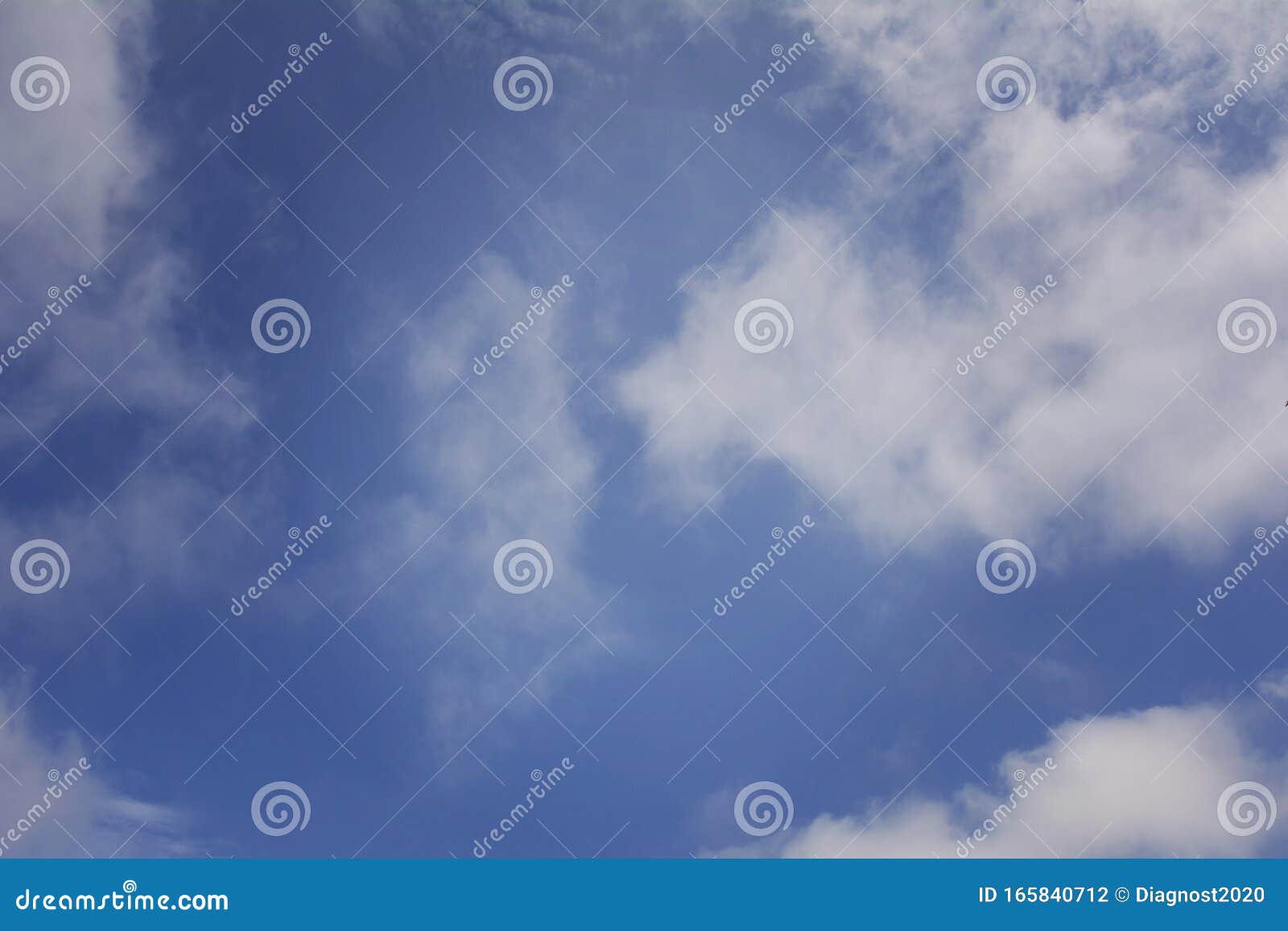 White Clouds Against a Blue Sky on a Sunny Day Stock Photo - Image of ...