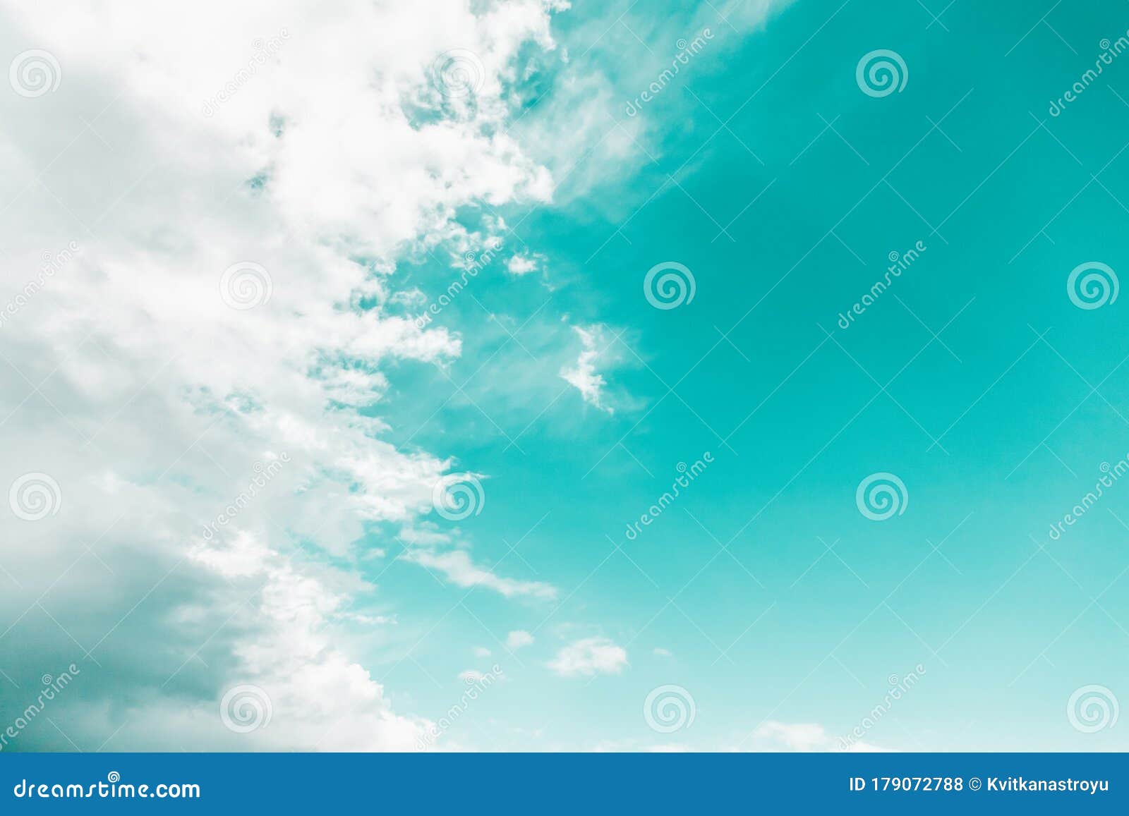 White Clouds on Mint Aqua Menthe Color Sky Background Stock Photo