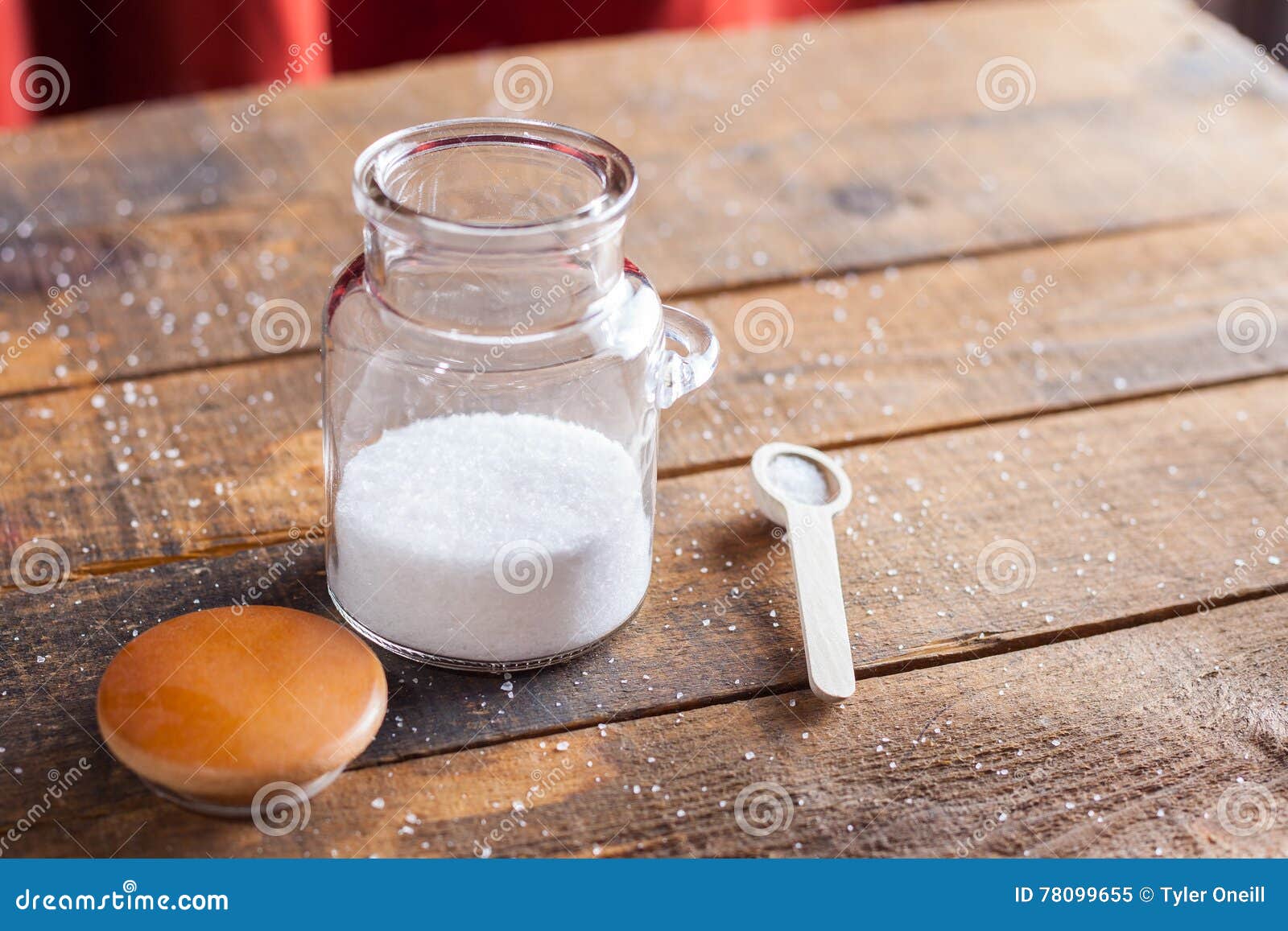White Coarse Ground Salt on Wooden Table Background with Serving Stock