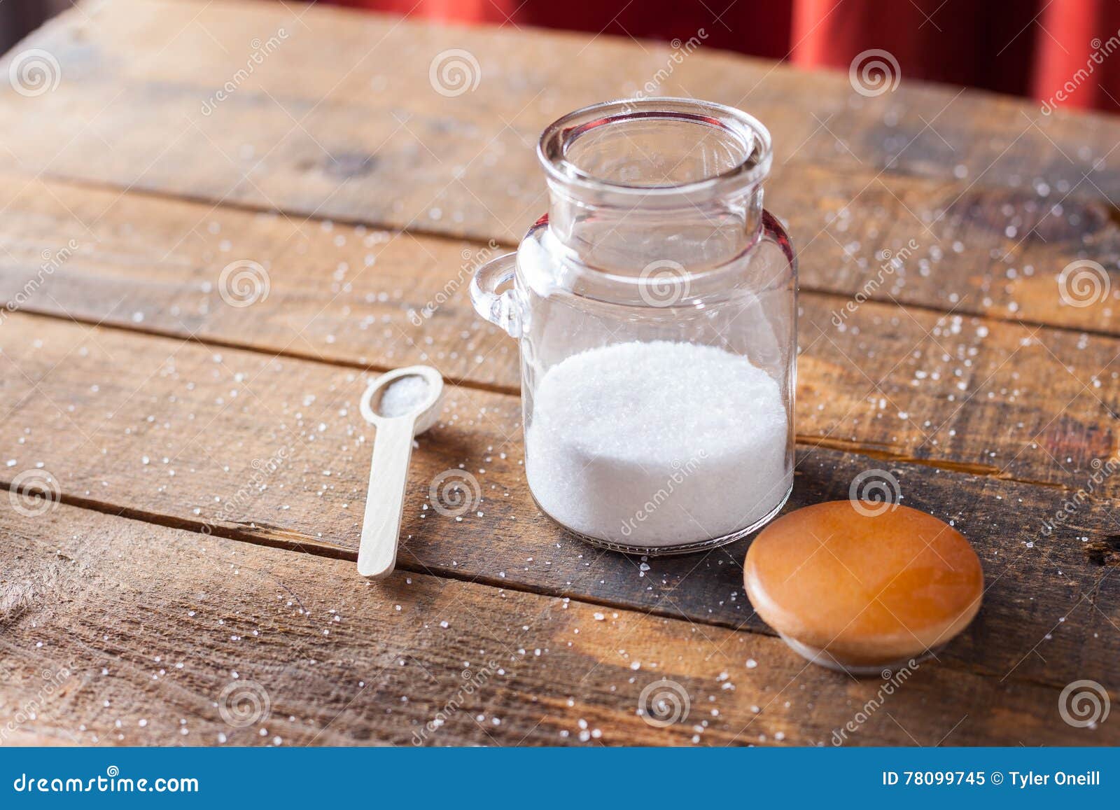 White Coarse Ground Salt on Wooden Table Background with Serving Stock