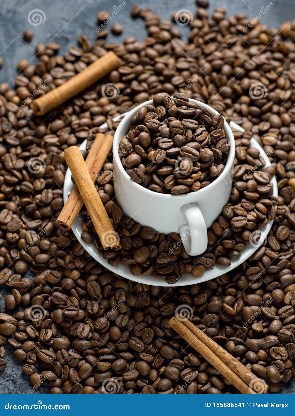 White Coffee Cup Filled with Top Quality Roasted Coffee Beans Stock