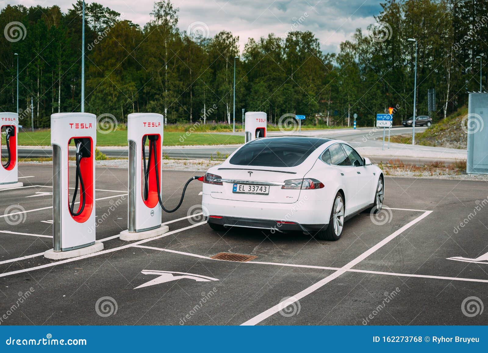 white color tesla model s p car parked charging station full sized all electric five door luxury tocksfors sweden june image