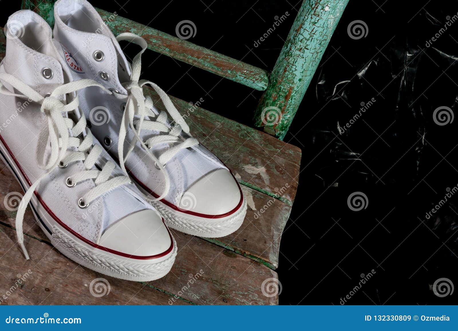 White Converse Sneakers on Green Chair Editorial Stock Image - Image of ...