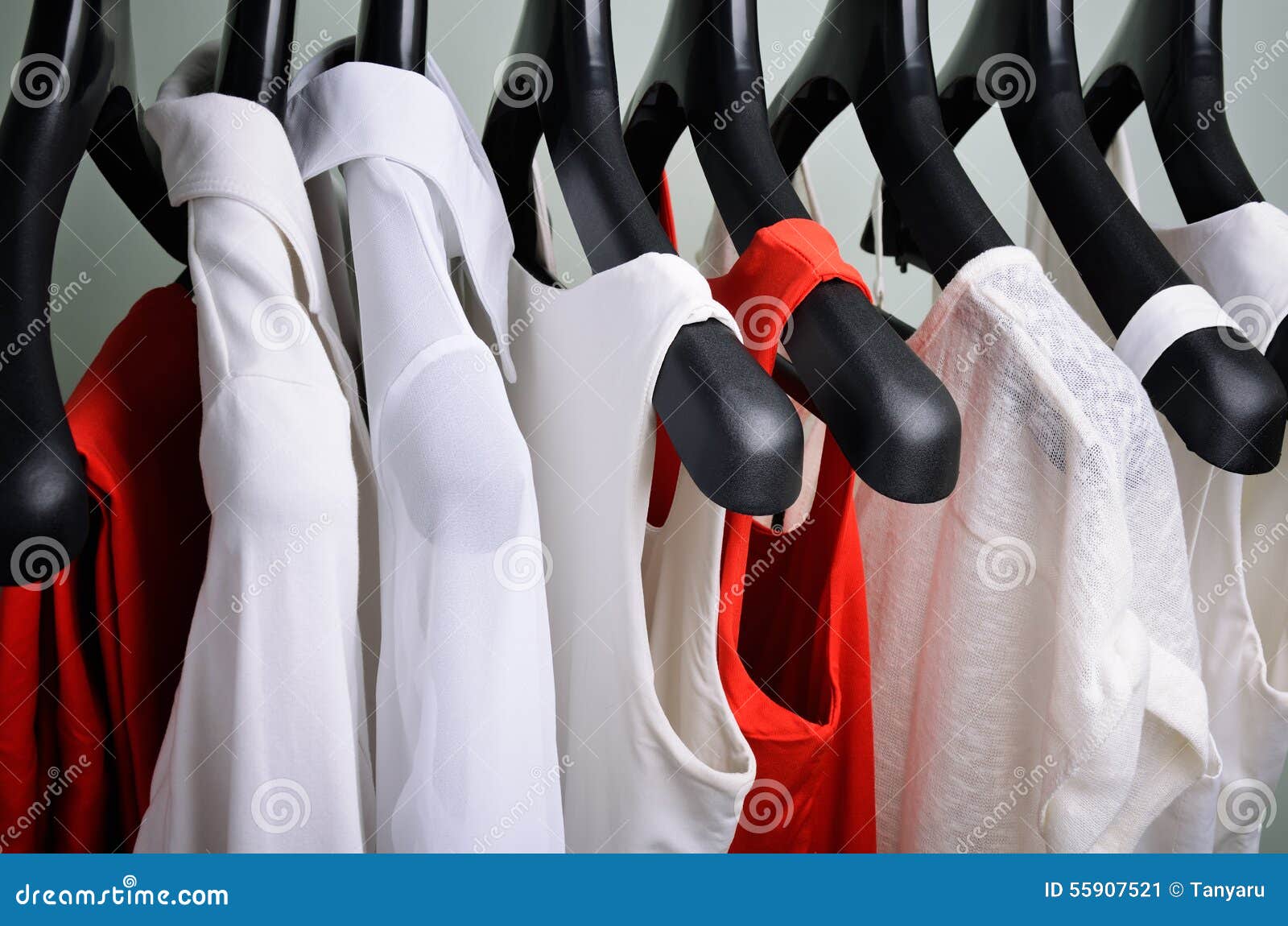 White and Coral Womens Clothing Hanging Horizontal Stock Image - Image ...