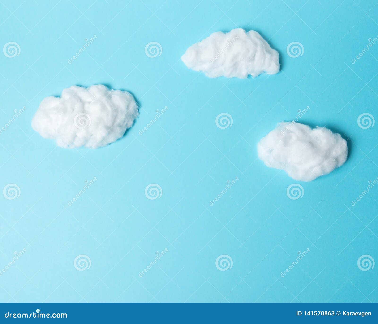 White Cotton Clouds on Pastel Blue Background. Minimal Concept