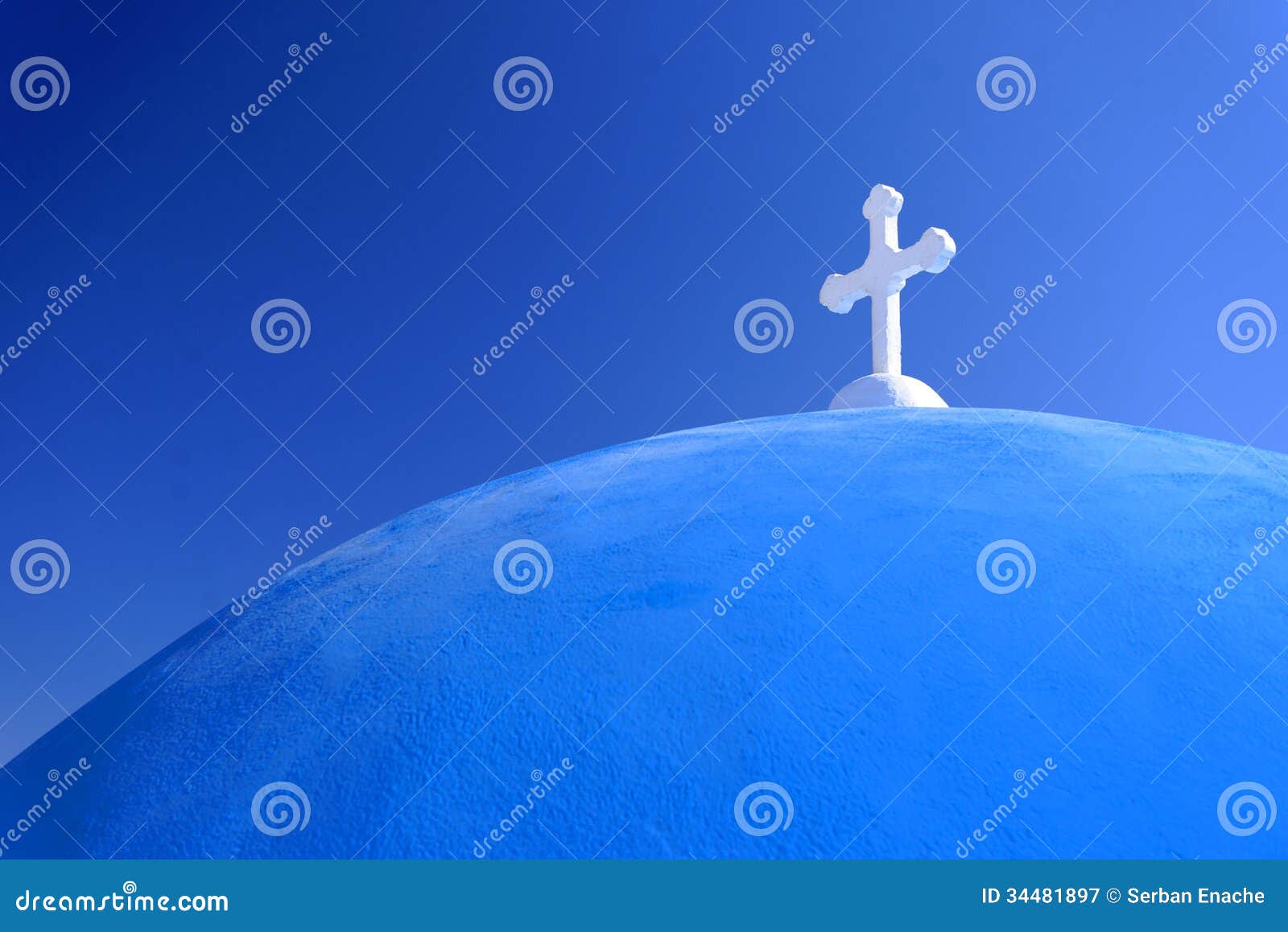 white cross on blue domed church