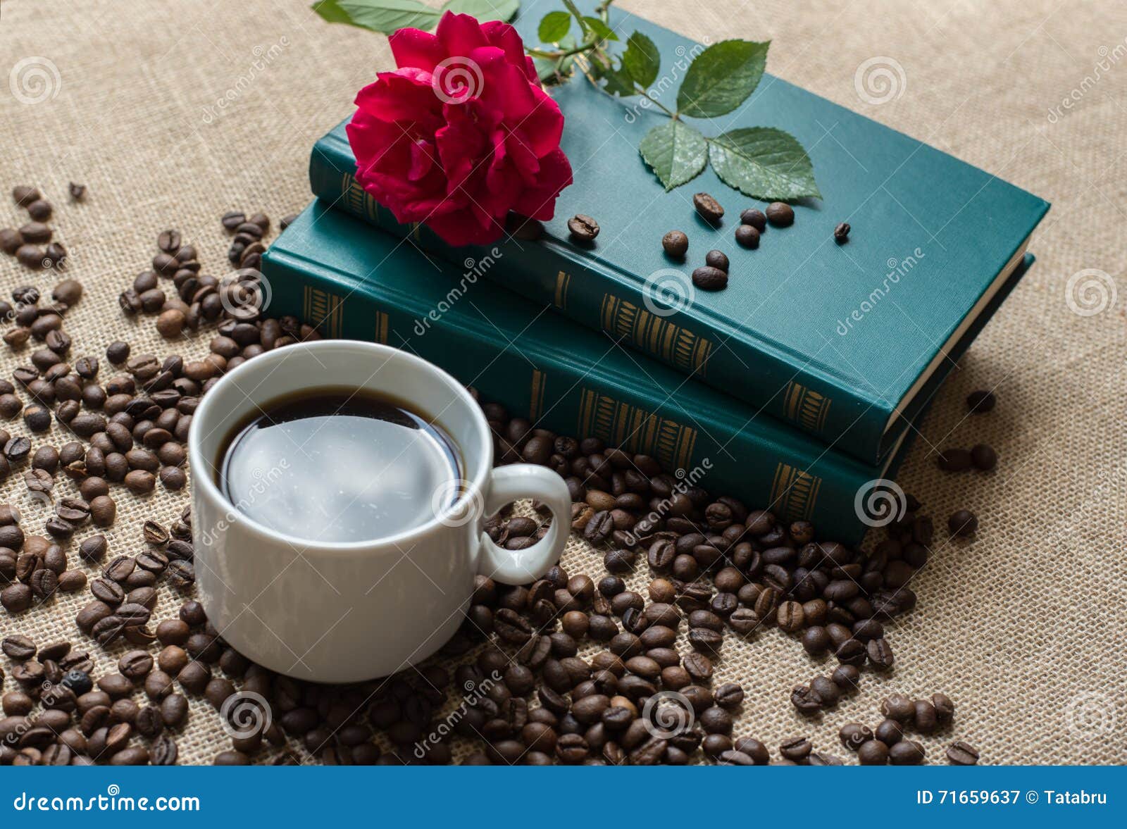 White Cup of Coffee, with Coffee Beans on Books Background Stock ...
