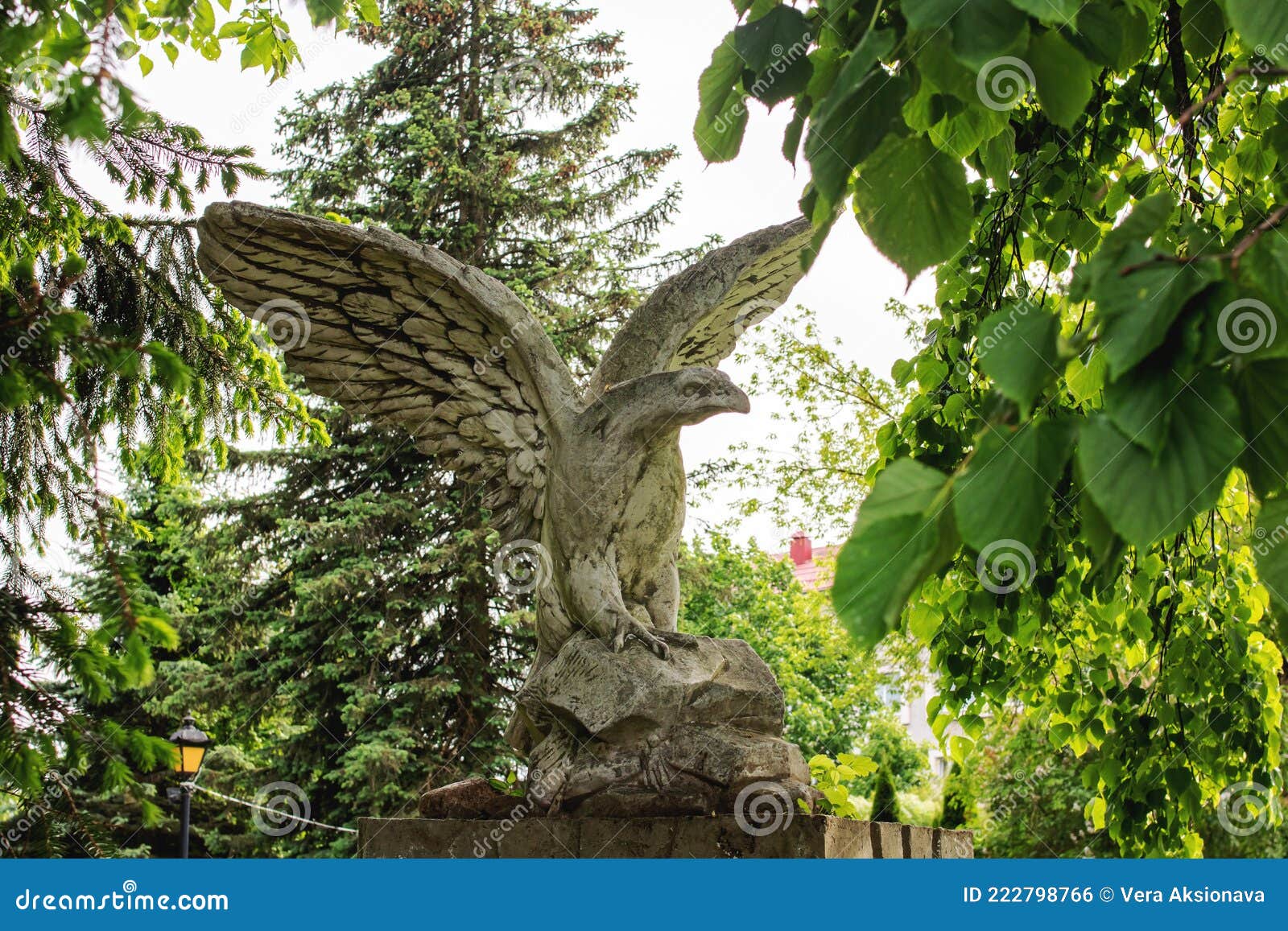 White Eagle Statue among Green Tree Branches Stock Photo Image of
