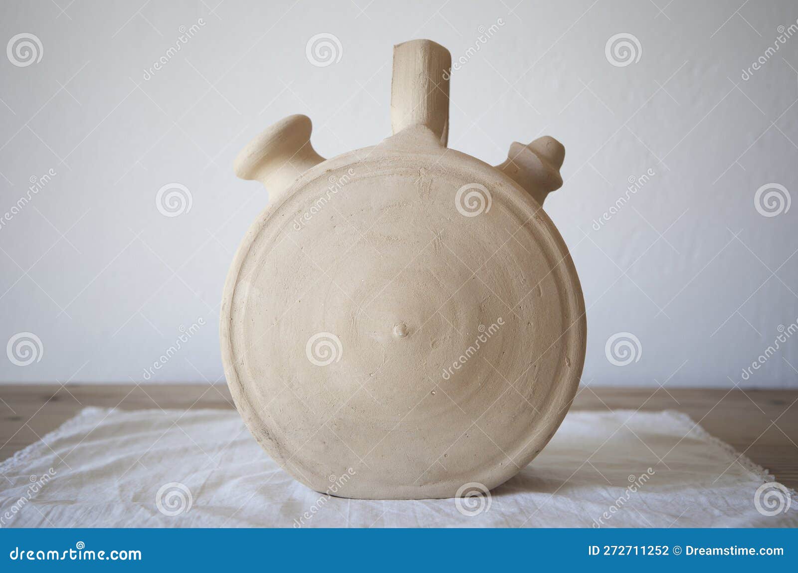 white earthenware botijo, traditional clay pot jug