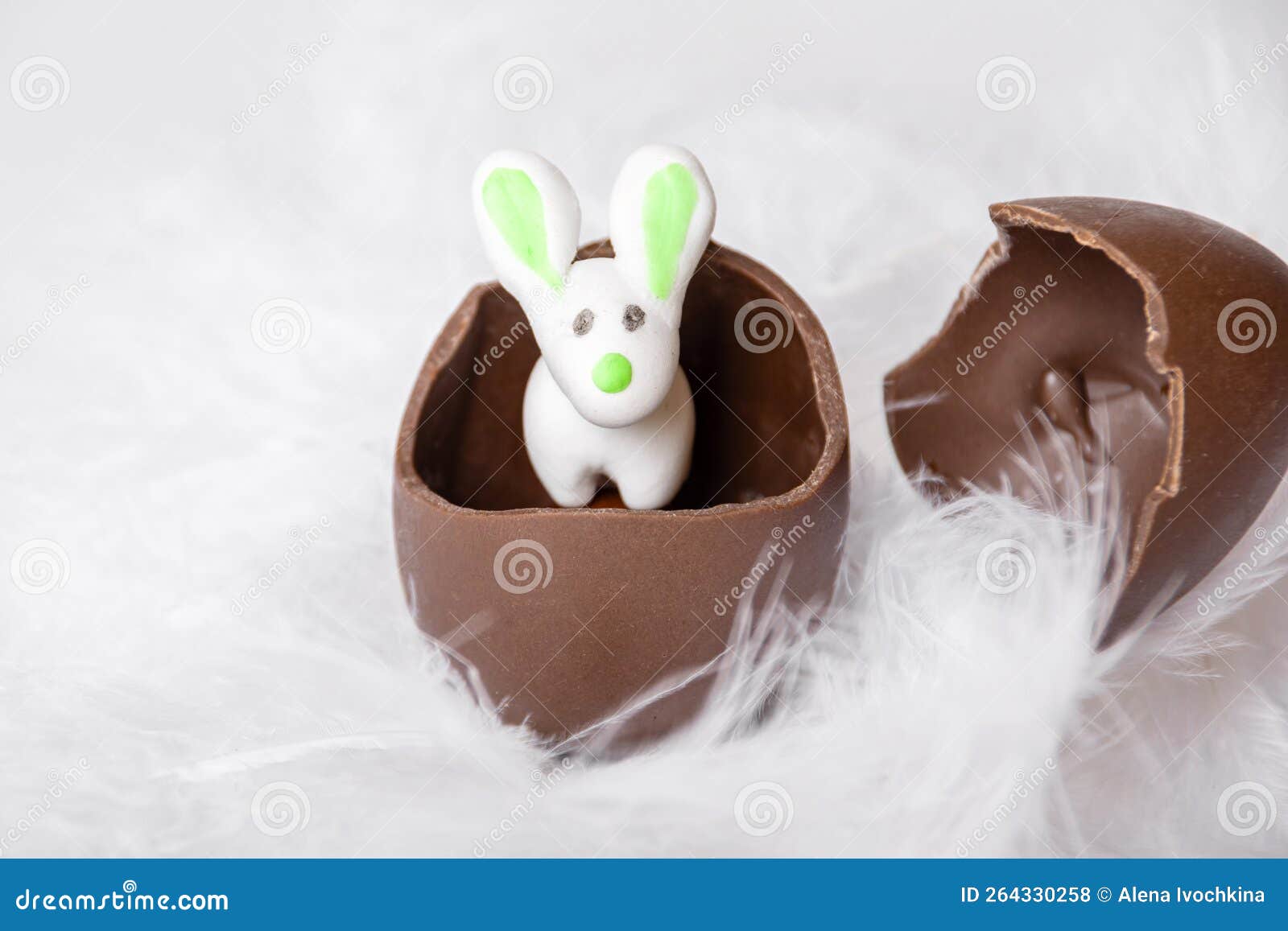Easter Marzipan Rabbit in a Cracked Chocolate Egg. Sweet Easter