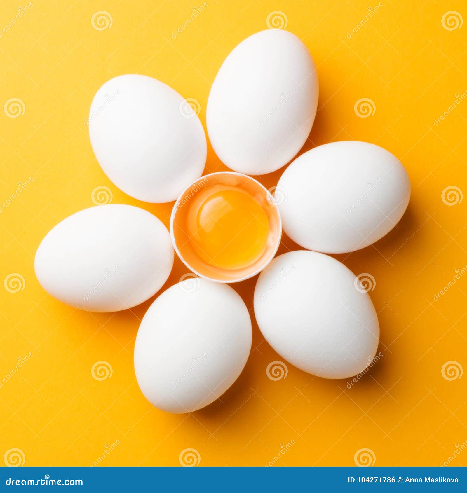 White Eggs and Egg Yolk on the Yellow Background. Topview, Square Stock