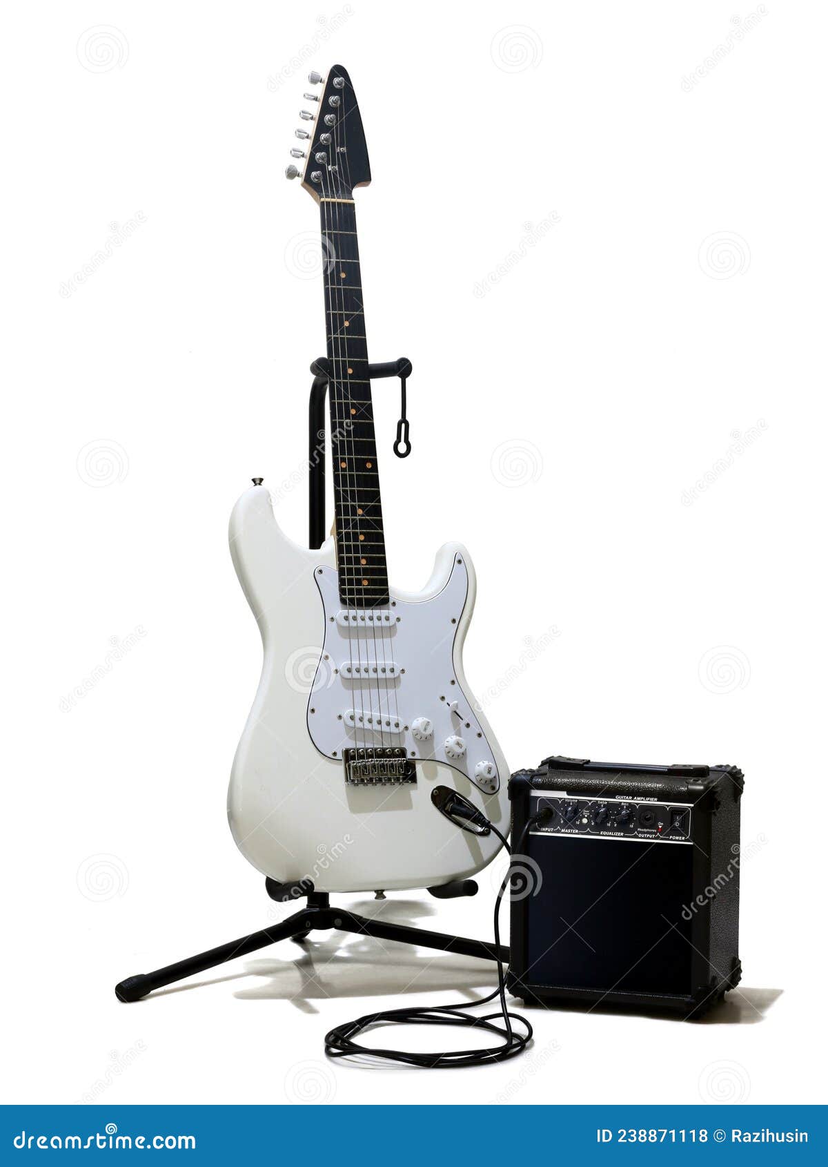 White Electric Guitar with Small Amplifier Stock Photo Image of front