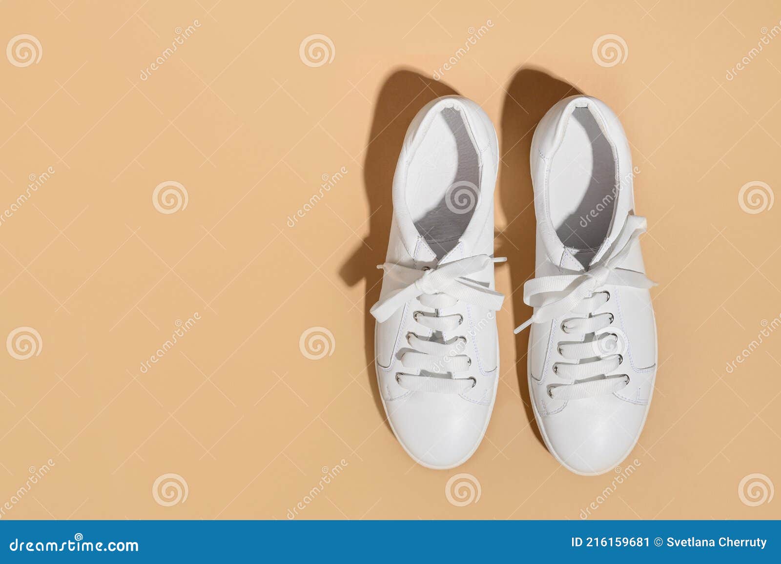 White New Female Gumshoes on Beige Background. Stock Image - Image of ...