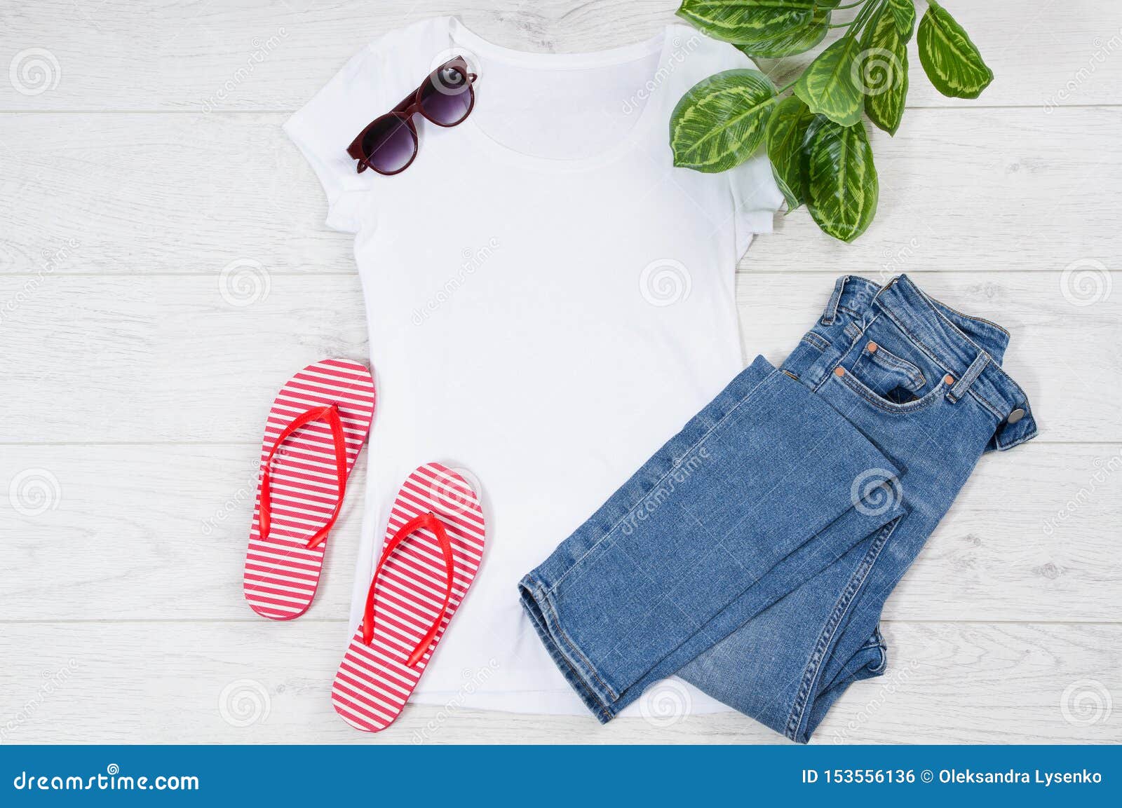 white female t shirt flip flops mock up flat lay on wooden background. top view and copy space. mockup t-shirt and summertime.