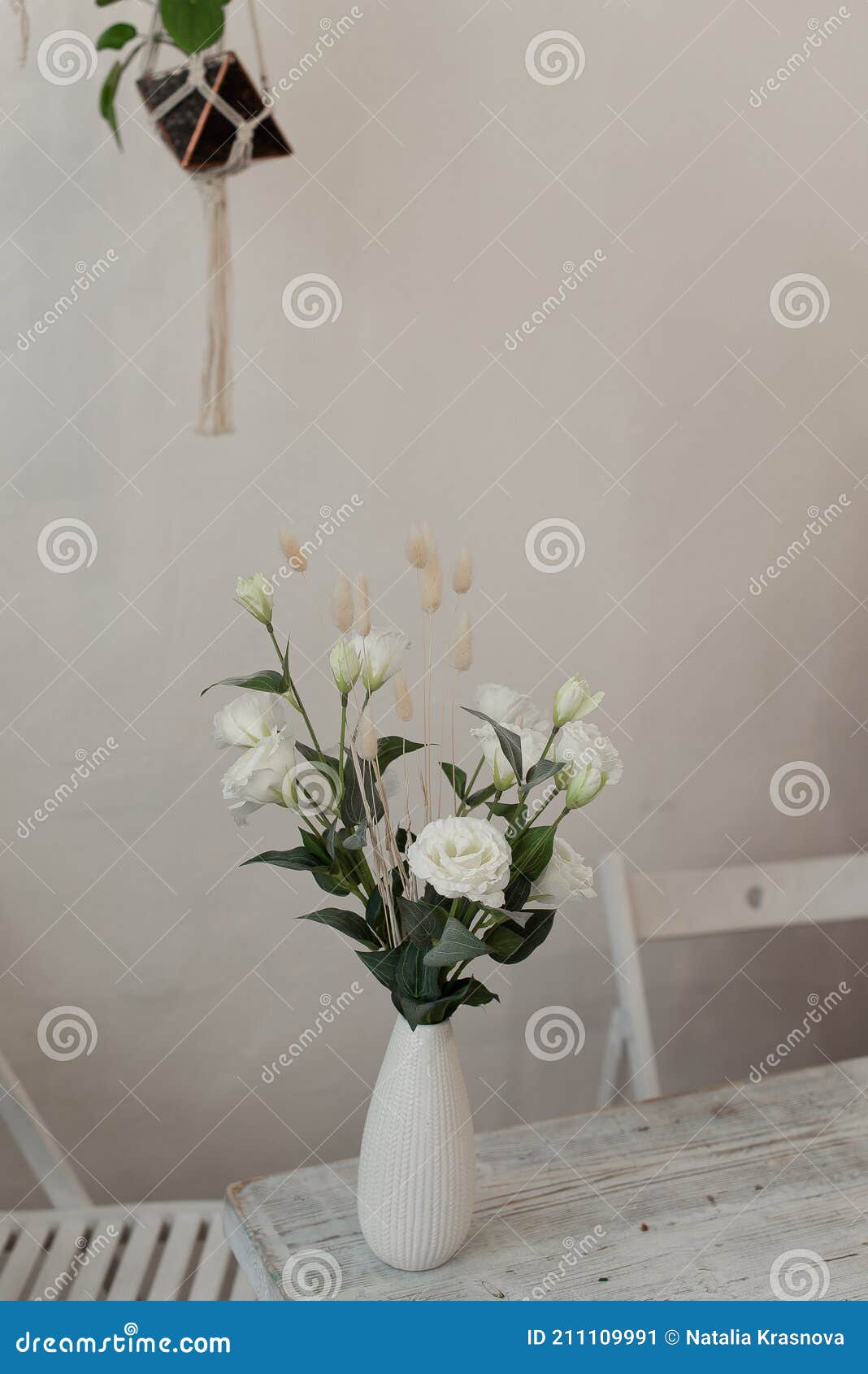 White Flowers in a Vase. a Beautiful Vase of Flowers Stands on the