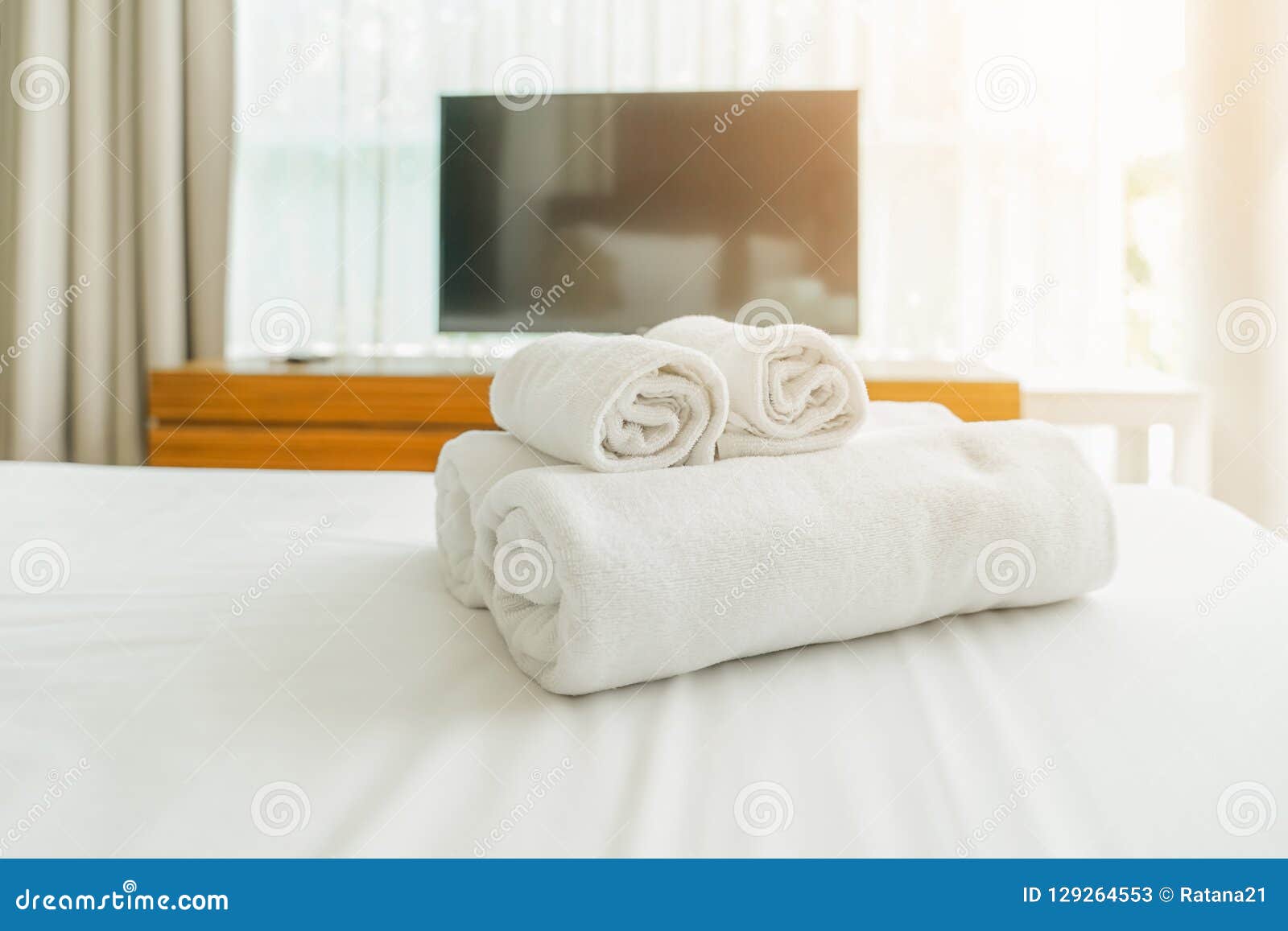 White Fluffy Towels On Bed For Hotel Customer Stock Photo