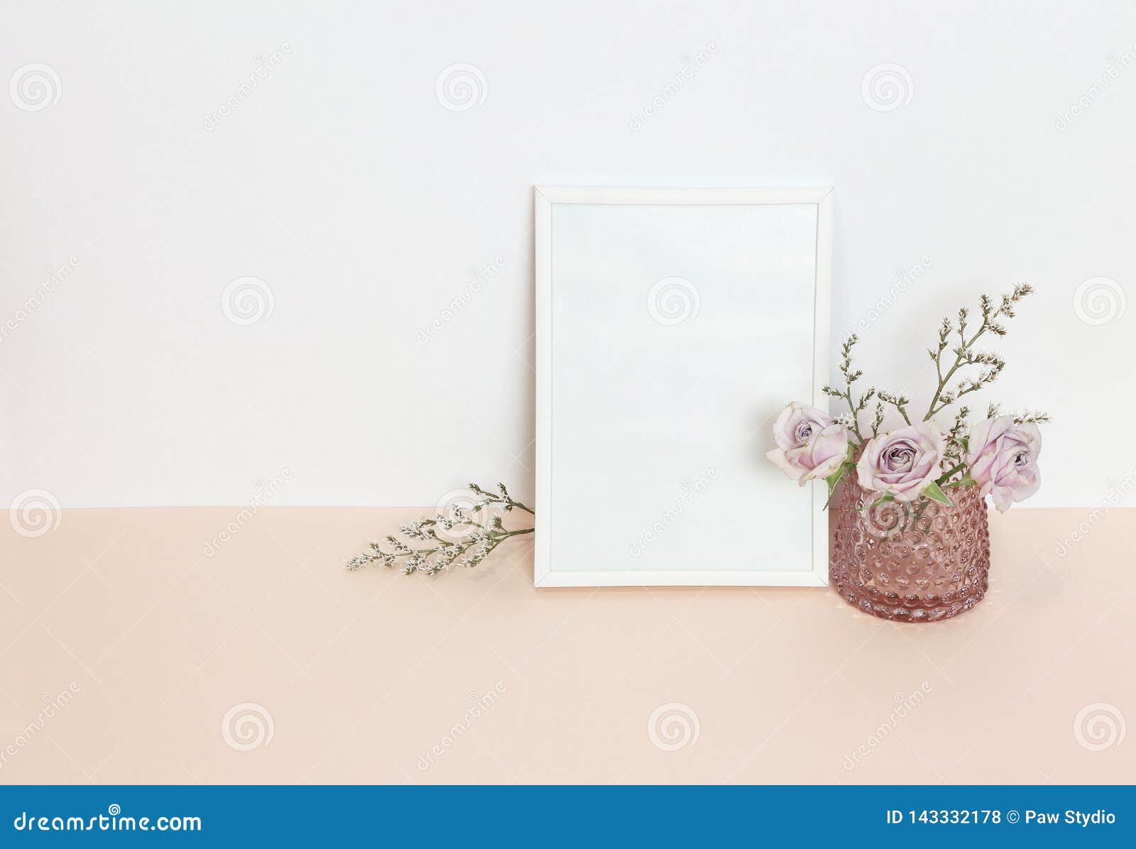 White Frame With Flowers On The Desk Stock Photo Image of green