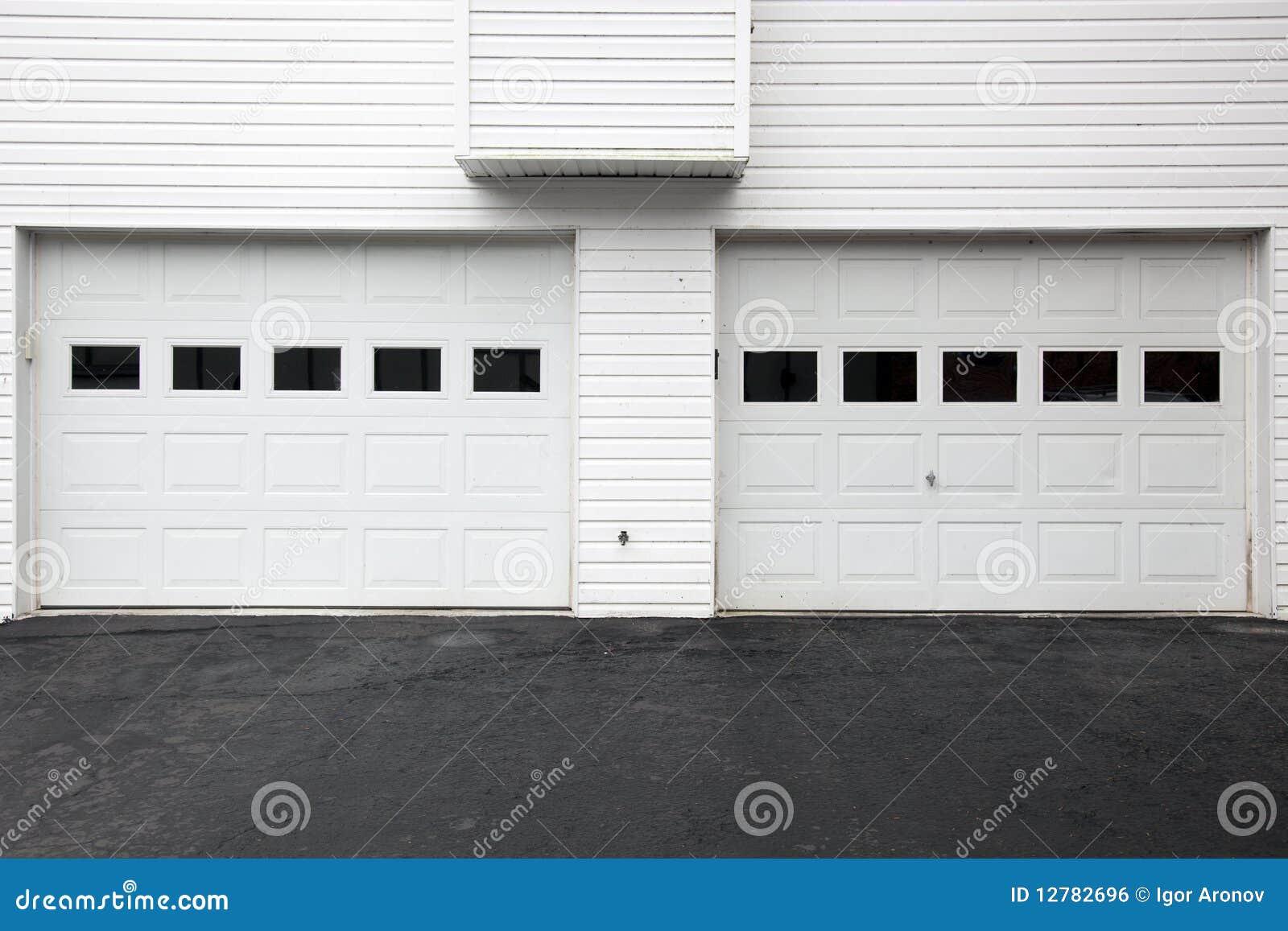 White garage doors stock photo. Image of asphalt, driveway 12782696