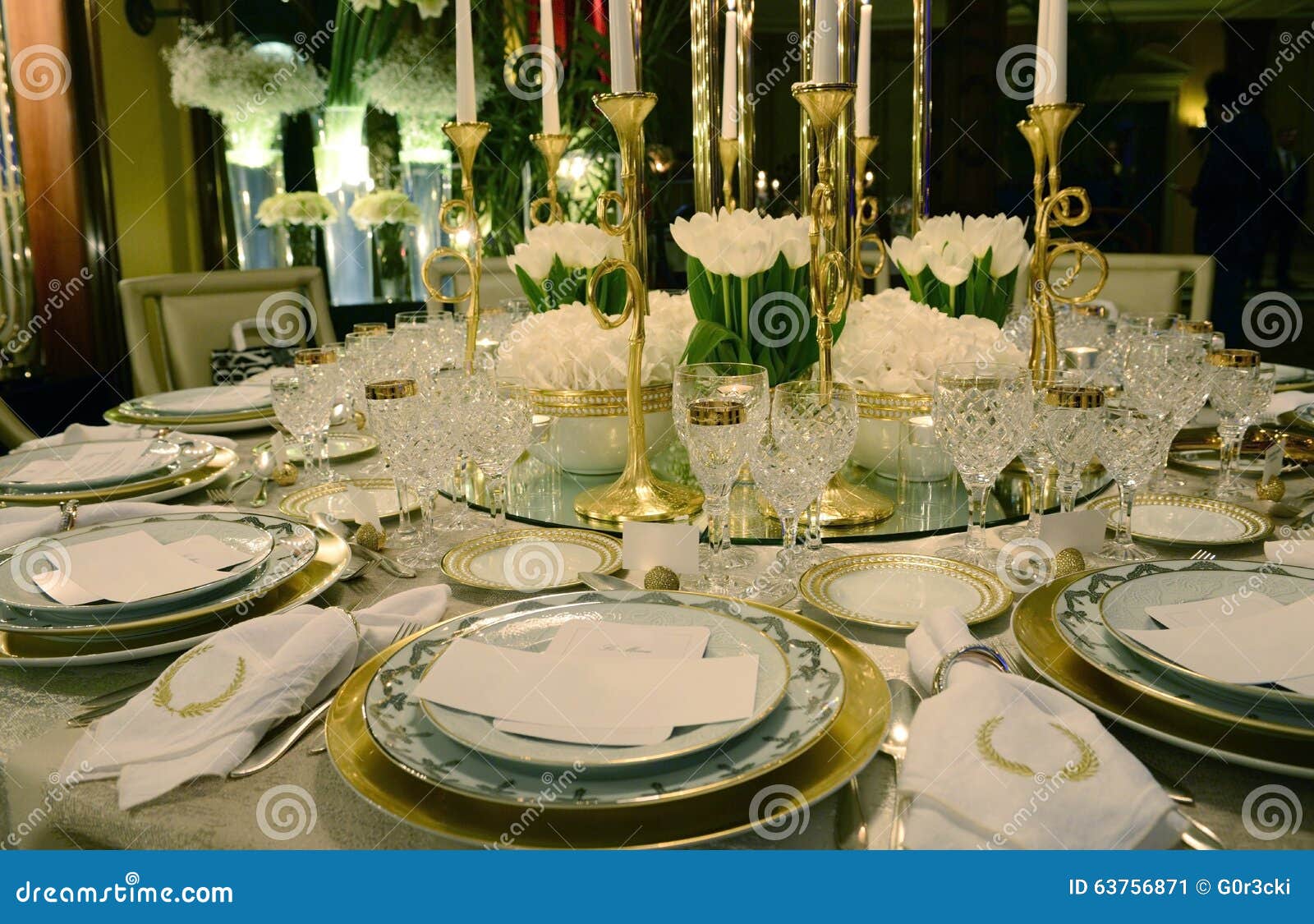 white and golden table decoration with white flowers, event