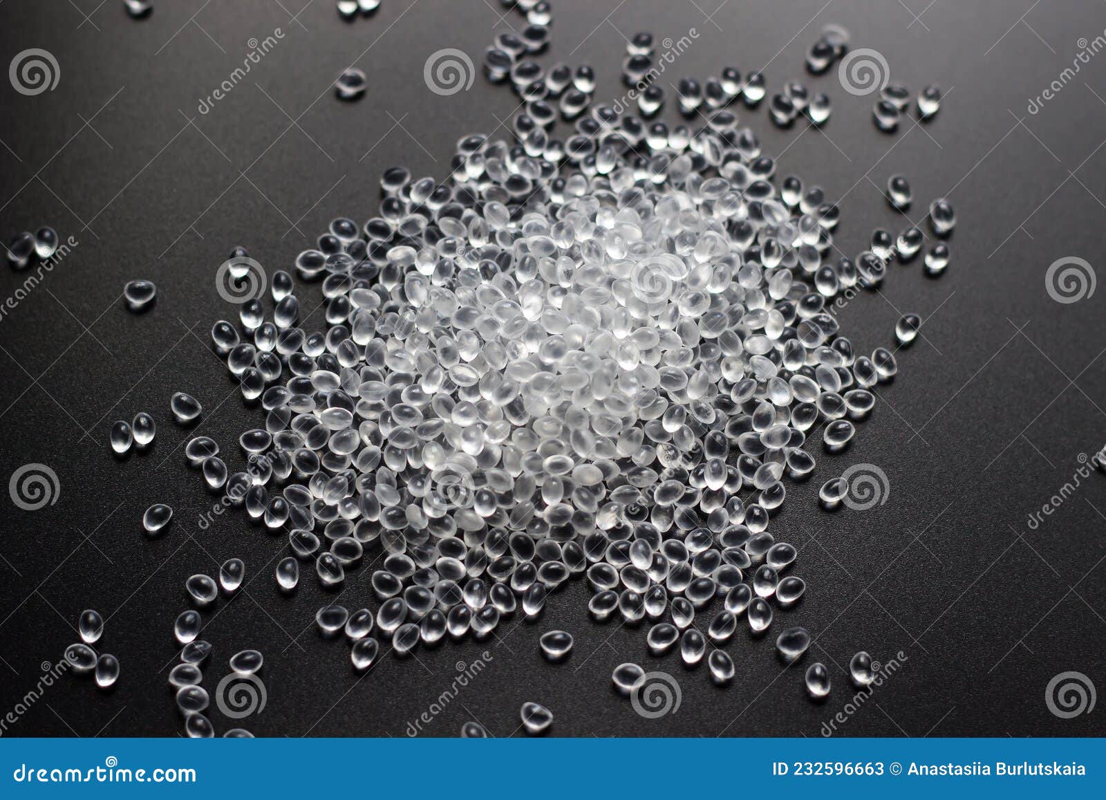 white granules of rubber, polypropylene or polyamide on a black background