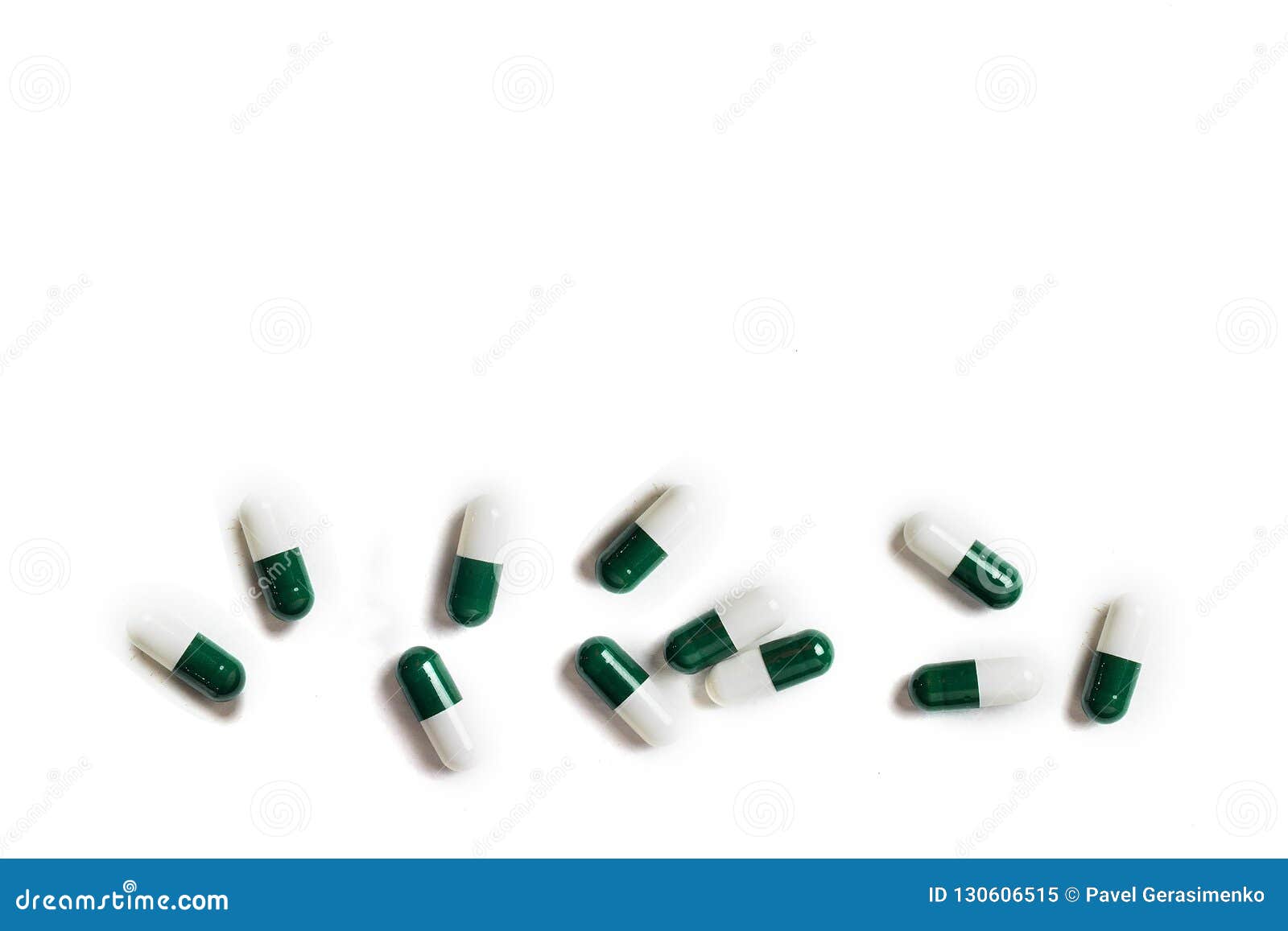 white-green pill capsules isolated on white background, medical concept, co...