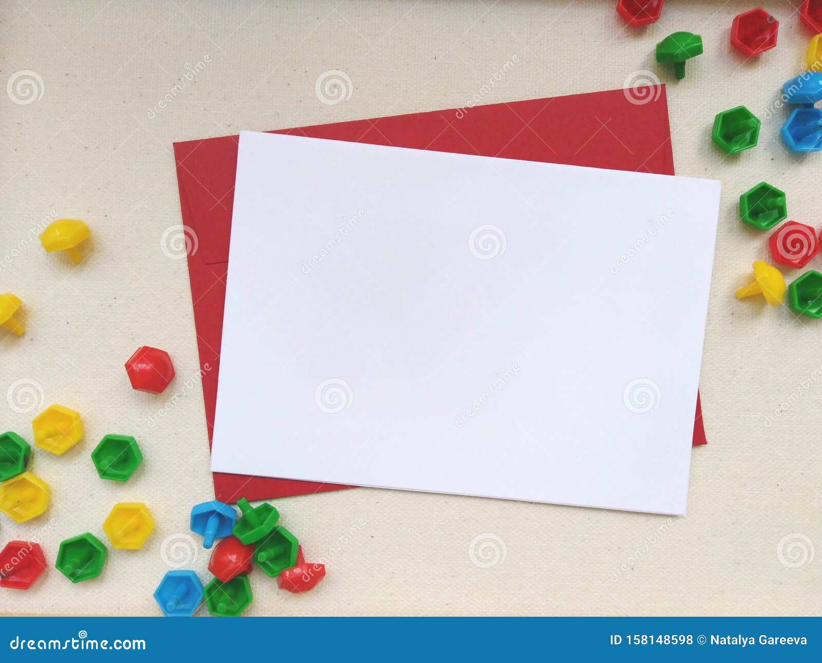 white greeting card template mockup with a red envelope on a creamy canvas background