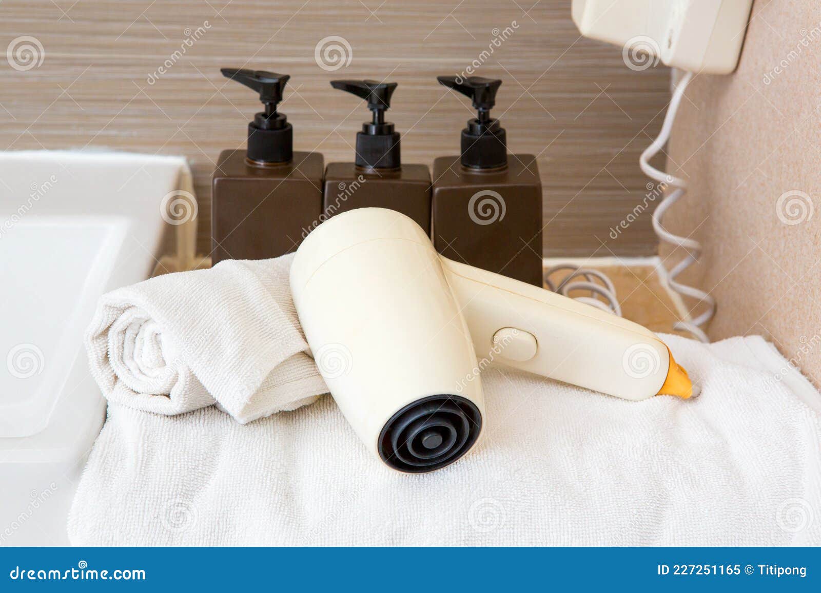 White Hair Dryer on the Towel in the Bathroom Stock Image Image of