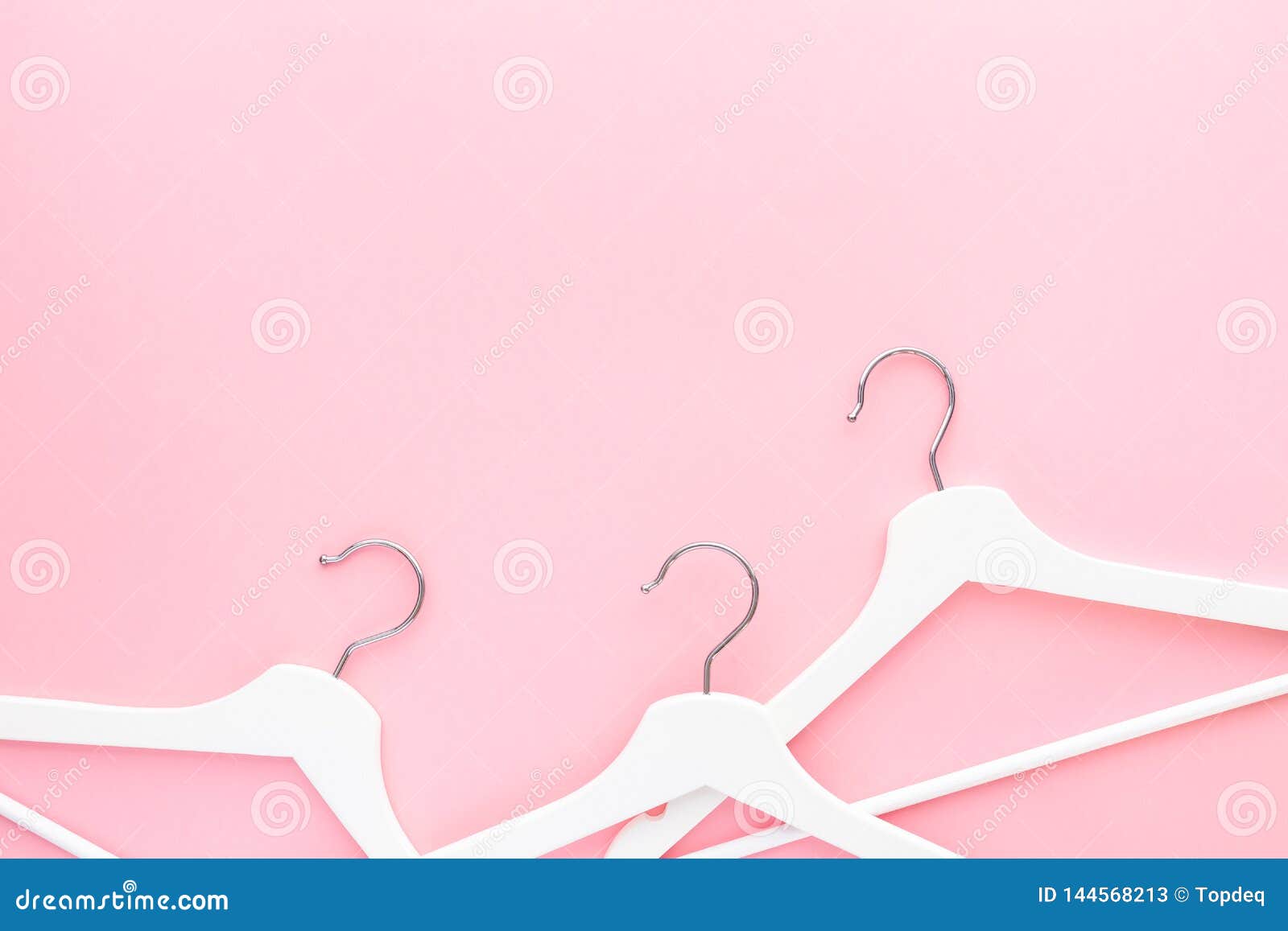 White Hangers on Pastel Pink Background Stock Image - Image of clothes,  space: 144568213