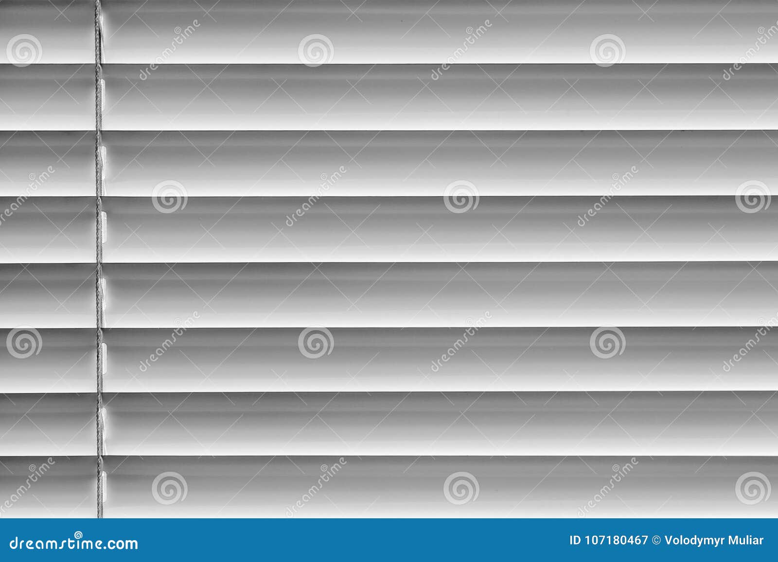 White Horizontal Blinds on the Window Create a Rhythm_ Stock Image