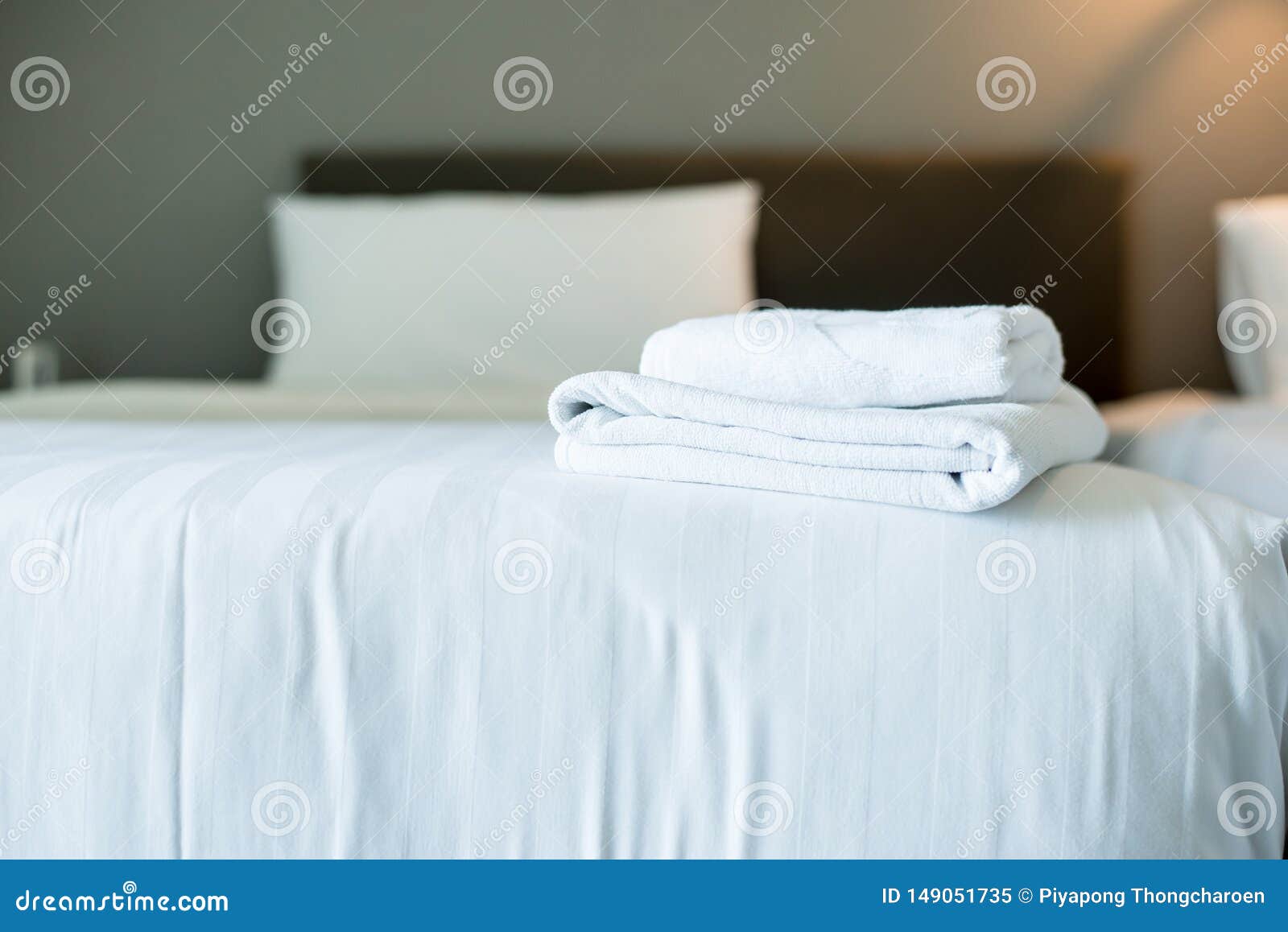 White Hotel Towel on Bed,Stack of Fluffy Bath Towels,Close Up,Copy