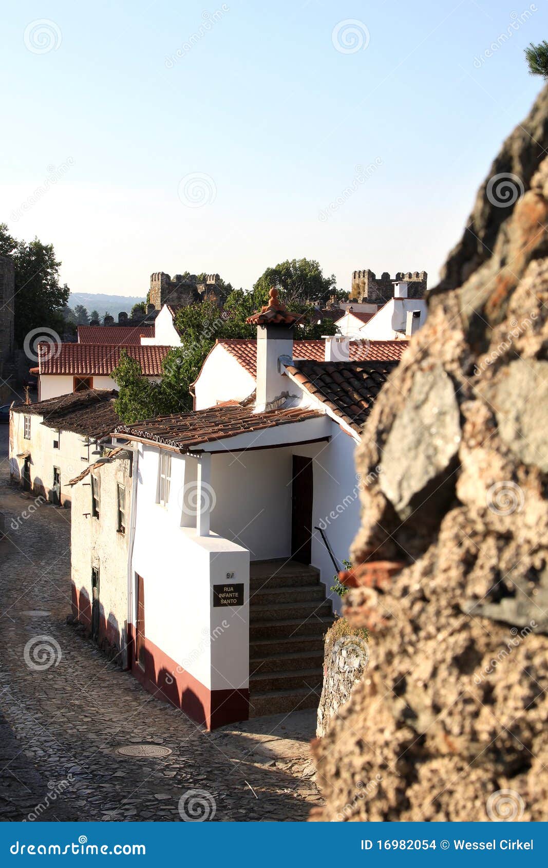 white houses within the ancient walls of fortress