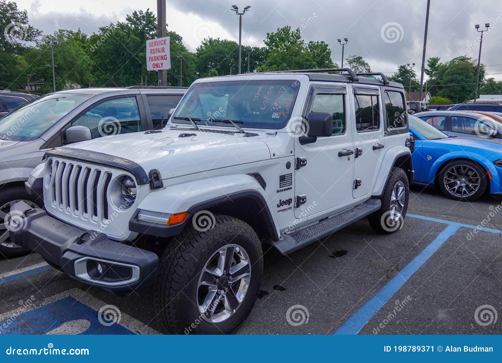 A White Jeep Wrangler Sahara Unlimited Sport is a Very Popular Vehicle on a  Dealership Lot Editorial Photo - Image of sport, rugged: 198789371