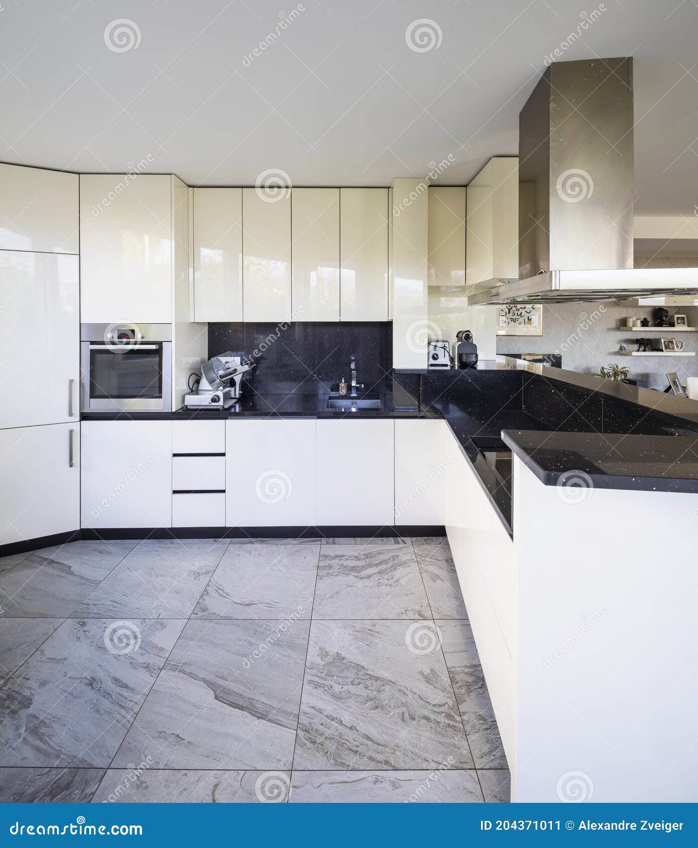 White Kitchen with Black Marble Top and Large Hood Stock Image Image
