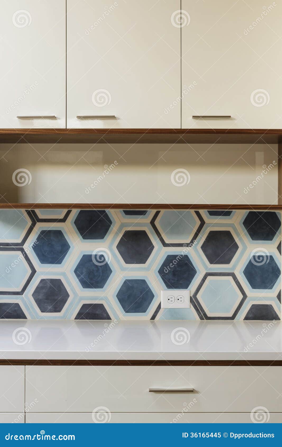 White Kitchen Cabinet In Modern Home With Blue Tile Stock Image
