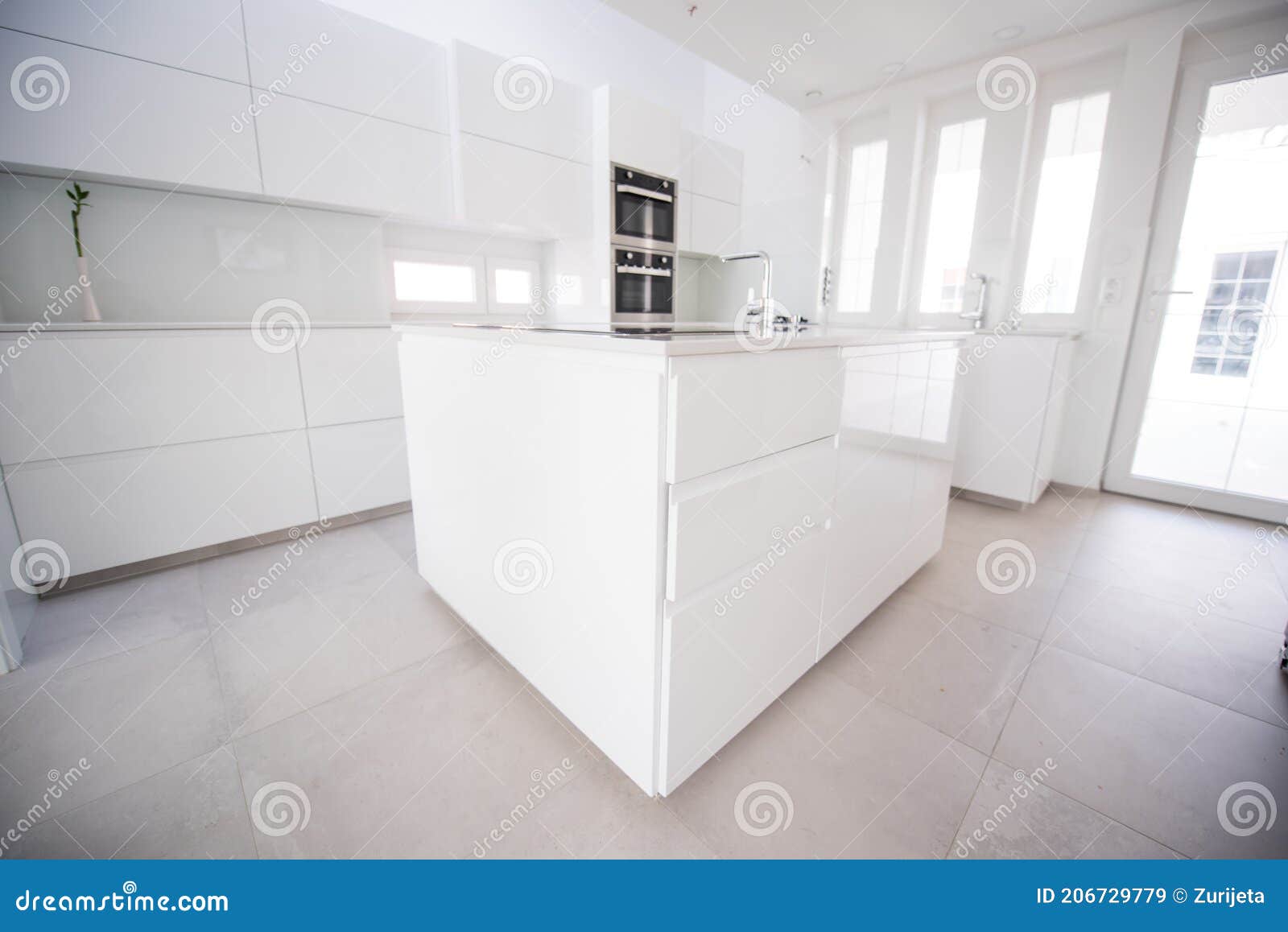 Modern White Kitchen ,Spacious Luxurious with Bar Design Stock Image
