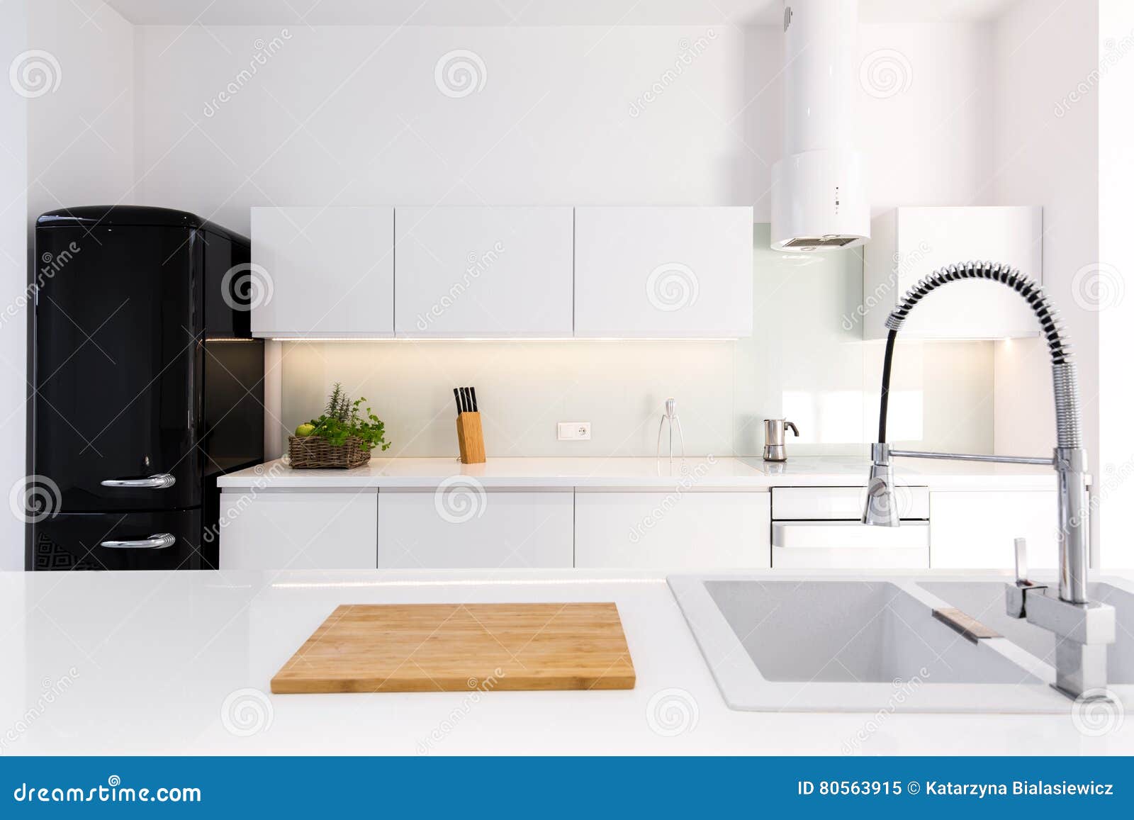 white, lacquer kitchen and black retro fridge